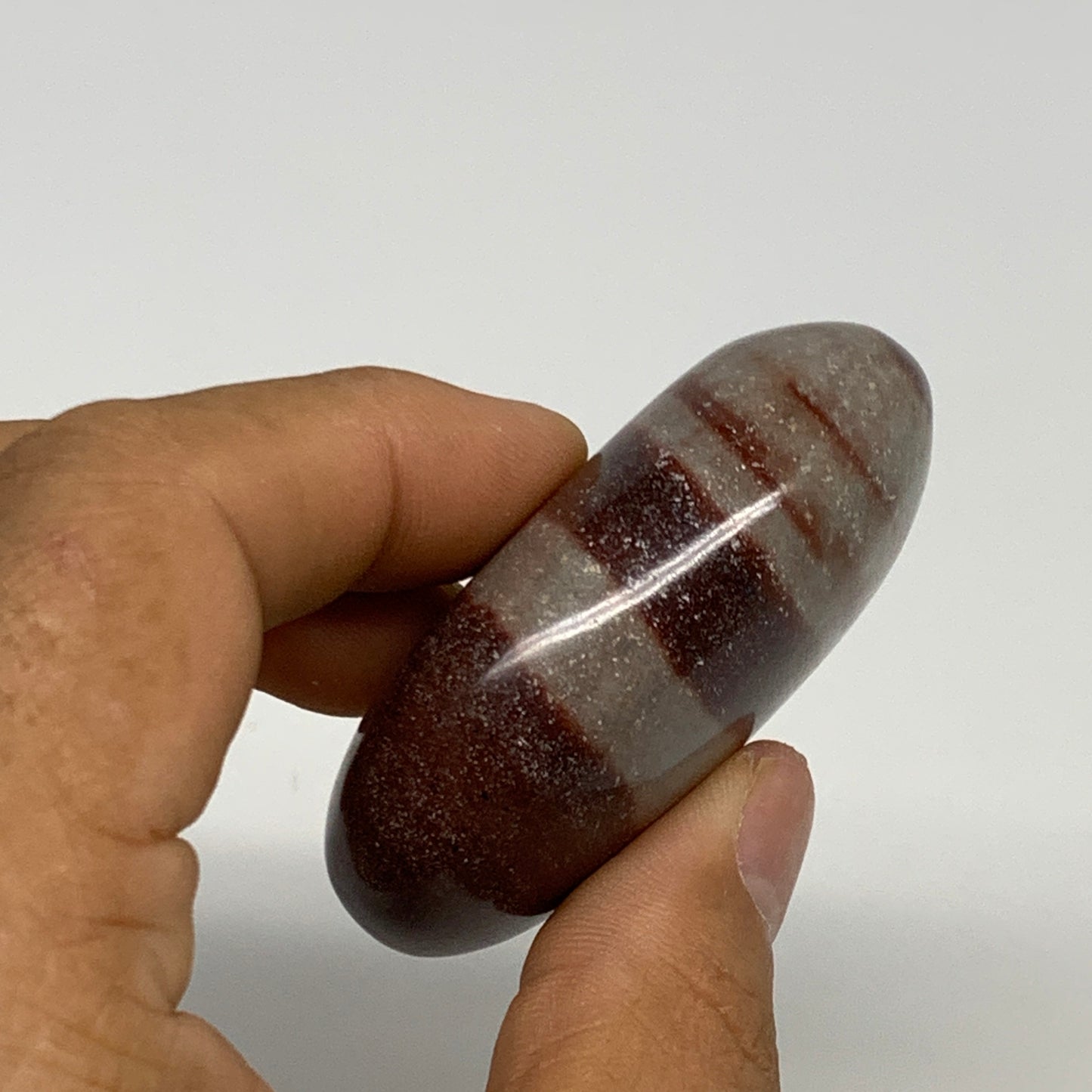 96g, 2.3"x1.8"x0.9", Narmada Shiva Lingam Palm-Stone Polished, B29361