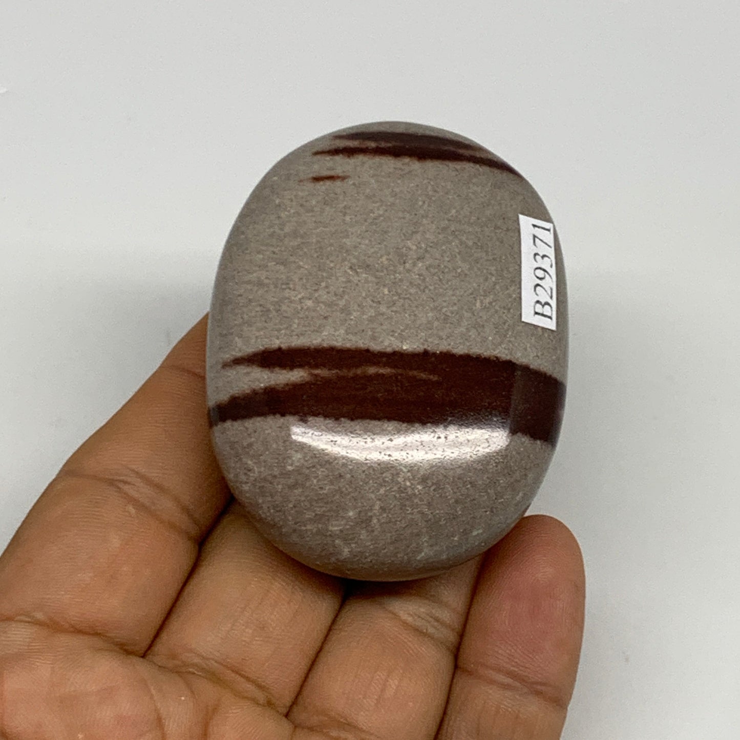 98.5g, 2.3"x1.8"x0.9", Narmada Shiva Lingam Palm-Stone Polished, B29371