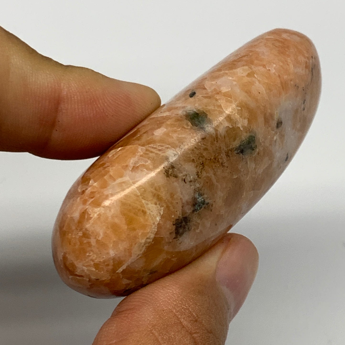 75.4g, 2.4"x1.4"x0.9", Orange Calcite Palm-Stone Crystal Polished Reiki, B16061