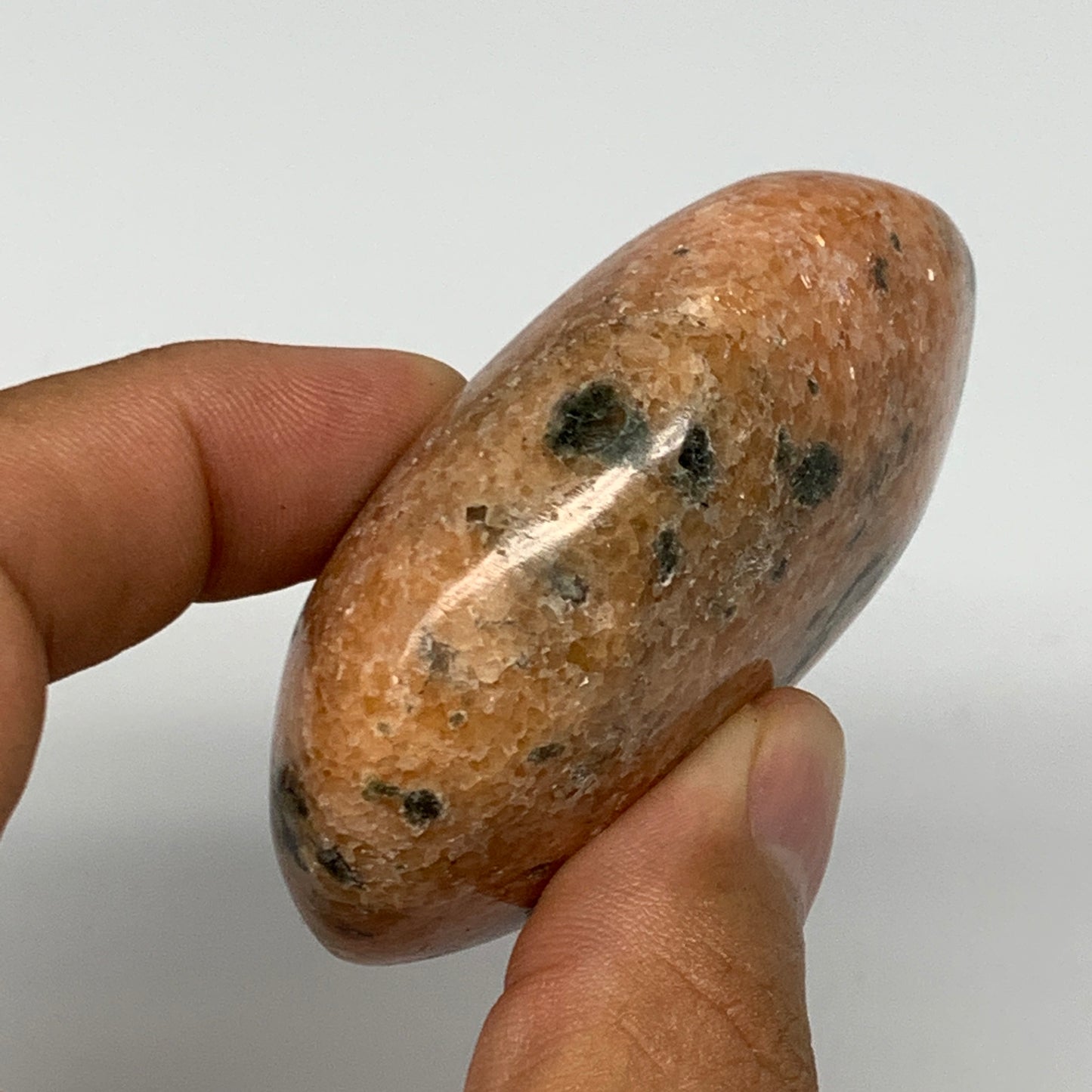 115.1g, 2.5"x1.8"x1", Orange Calcite Palm-Stone Crystal Polished Reiki, B16065
