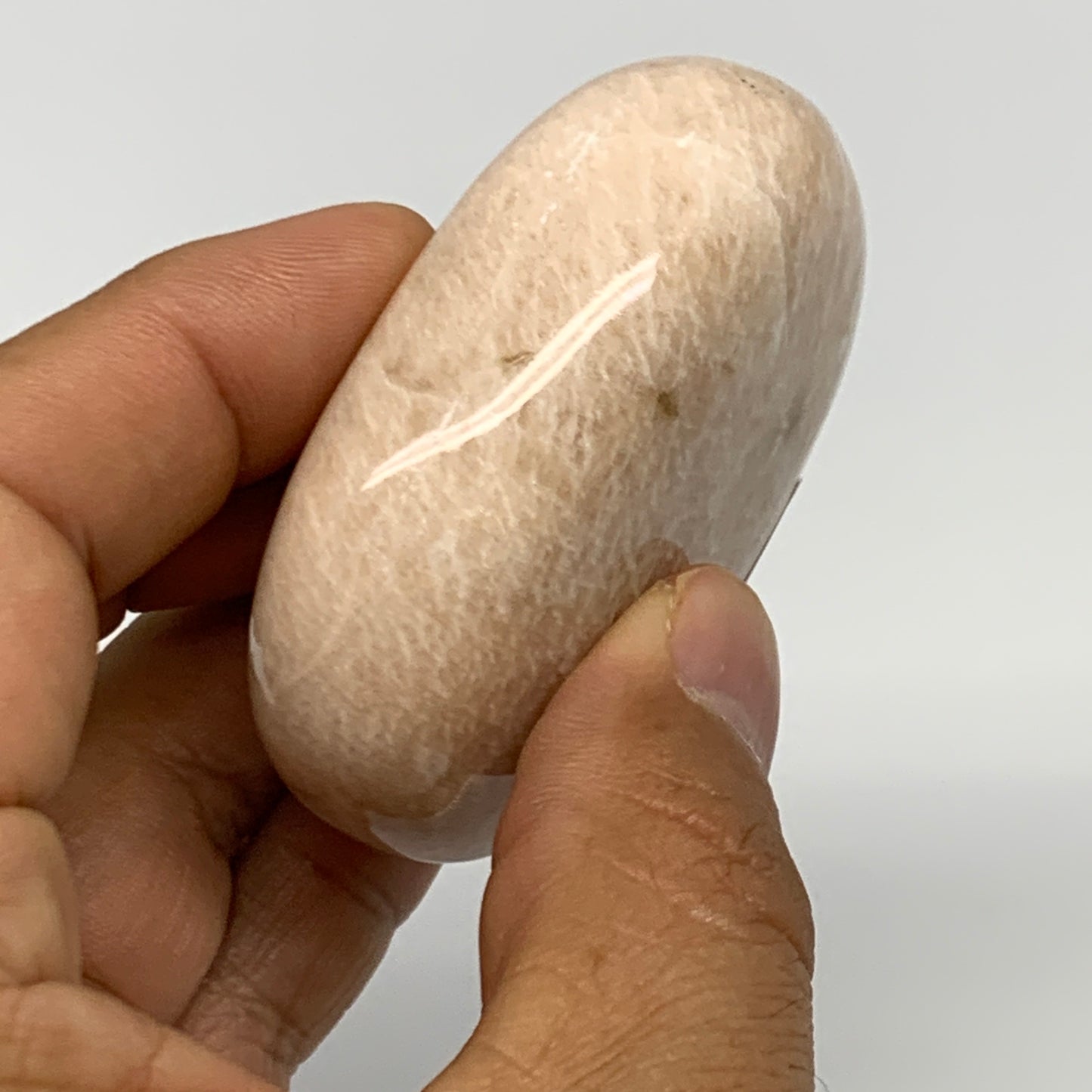 109.4g,2.3"x1.8"x0.9" Peach Moonstone Crystal Palm-Stone Polished Reiki, B27989