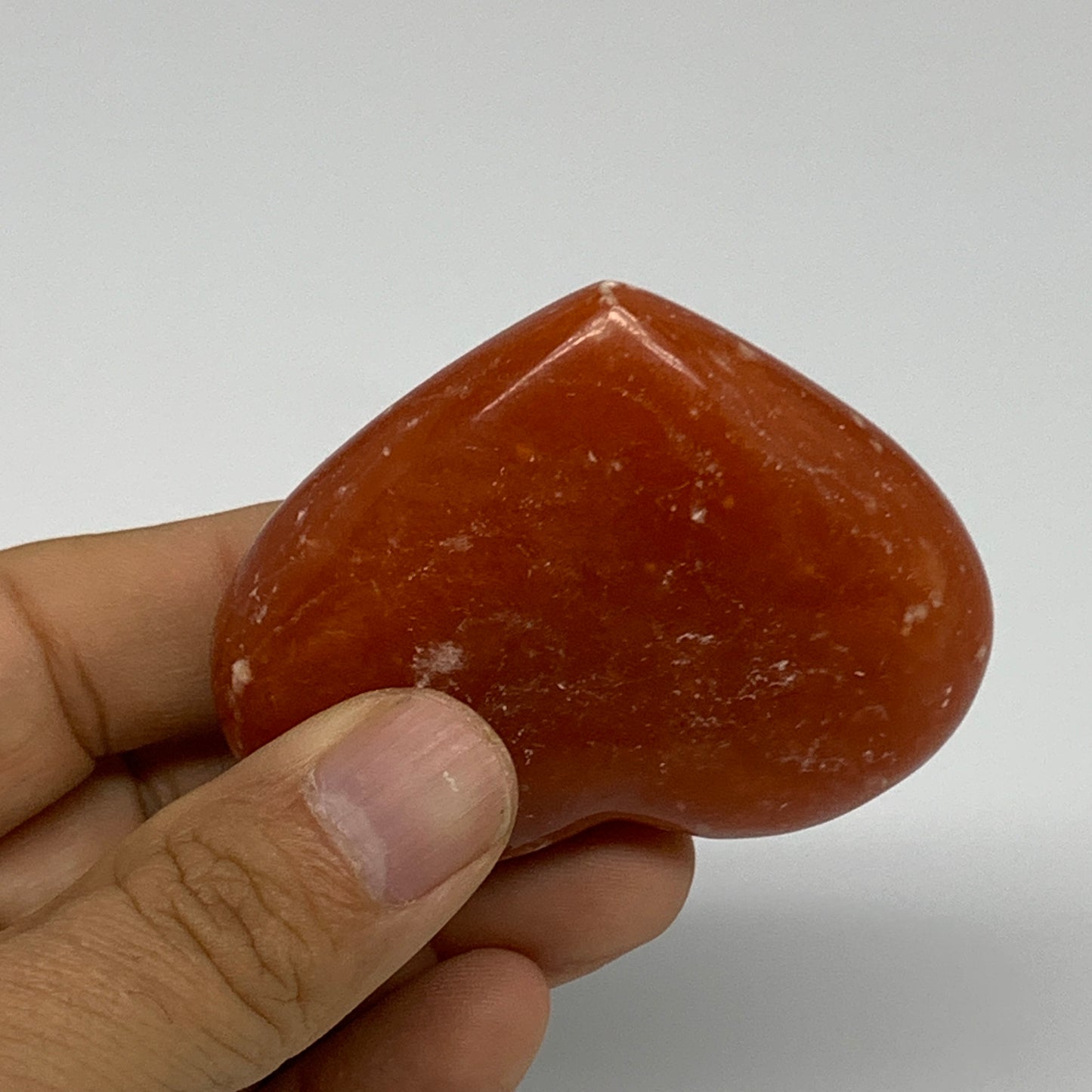 97.7g,2.1"x2.6"x0.9" Orange Calcite Heart Gemstones from Madagascar, B33802