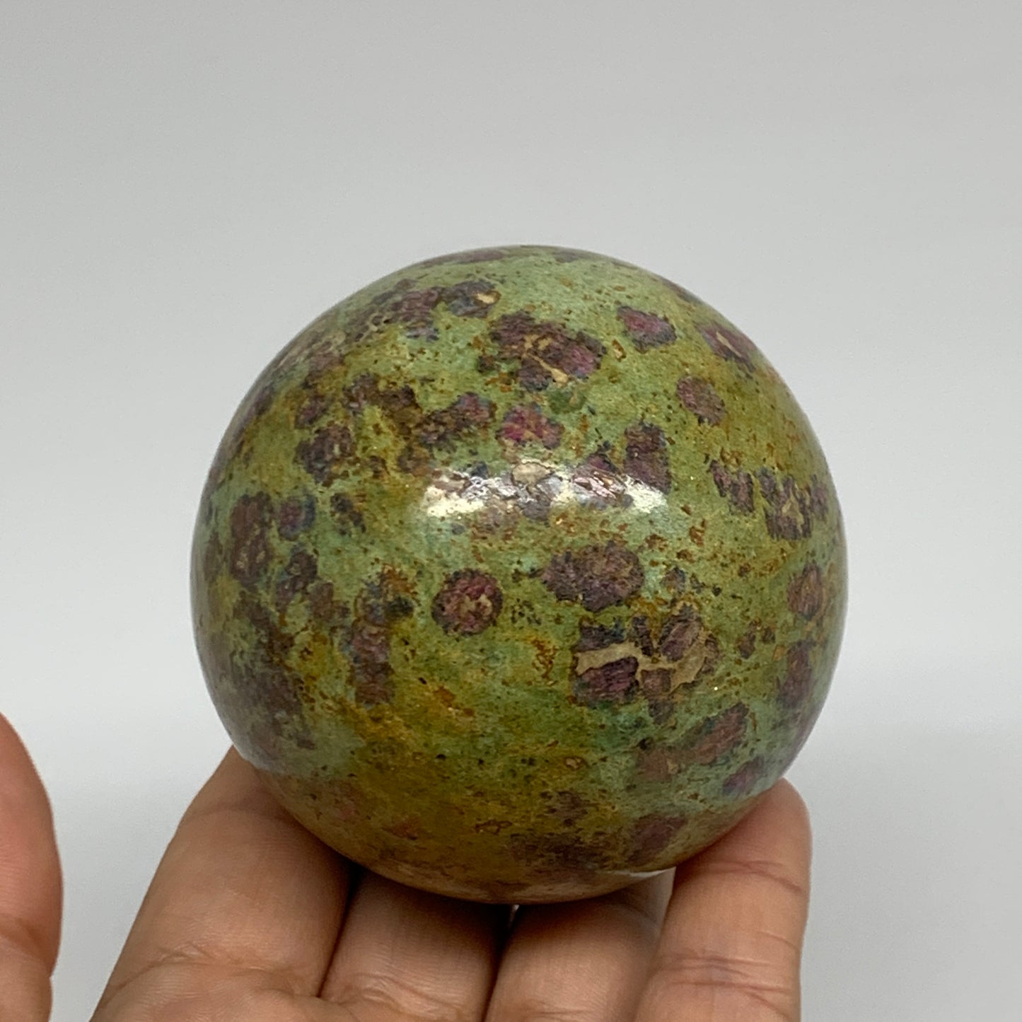 1.15 lbs, 2.7"(69mm), Zoisite with Ruby Sphere Sphere Ball Crystal, B25218