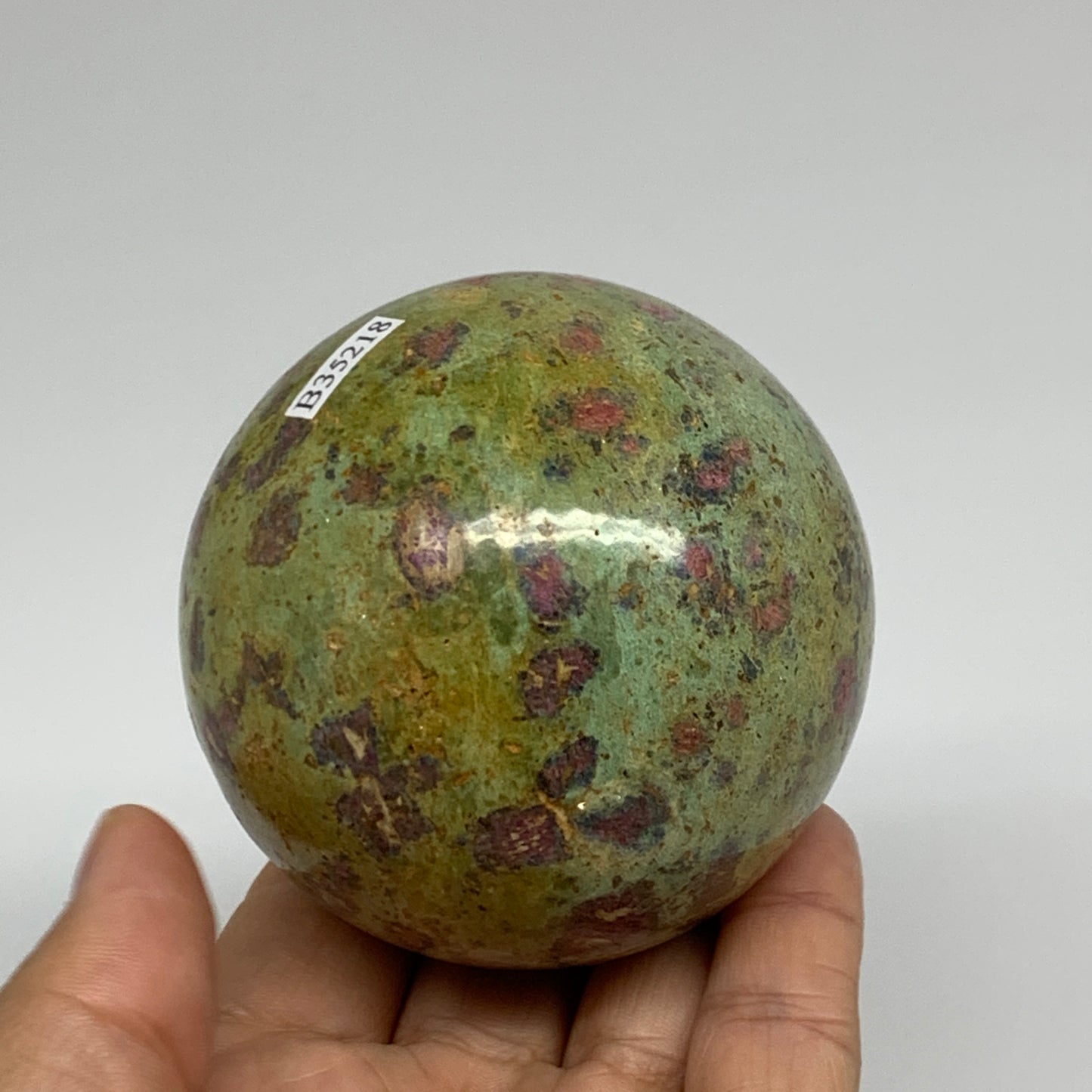 1.15 lbs, 2.7"(69mm), Zoisite with Ruby Sphere Sphere Ball Crystal, B25218