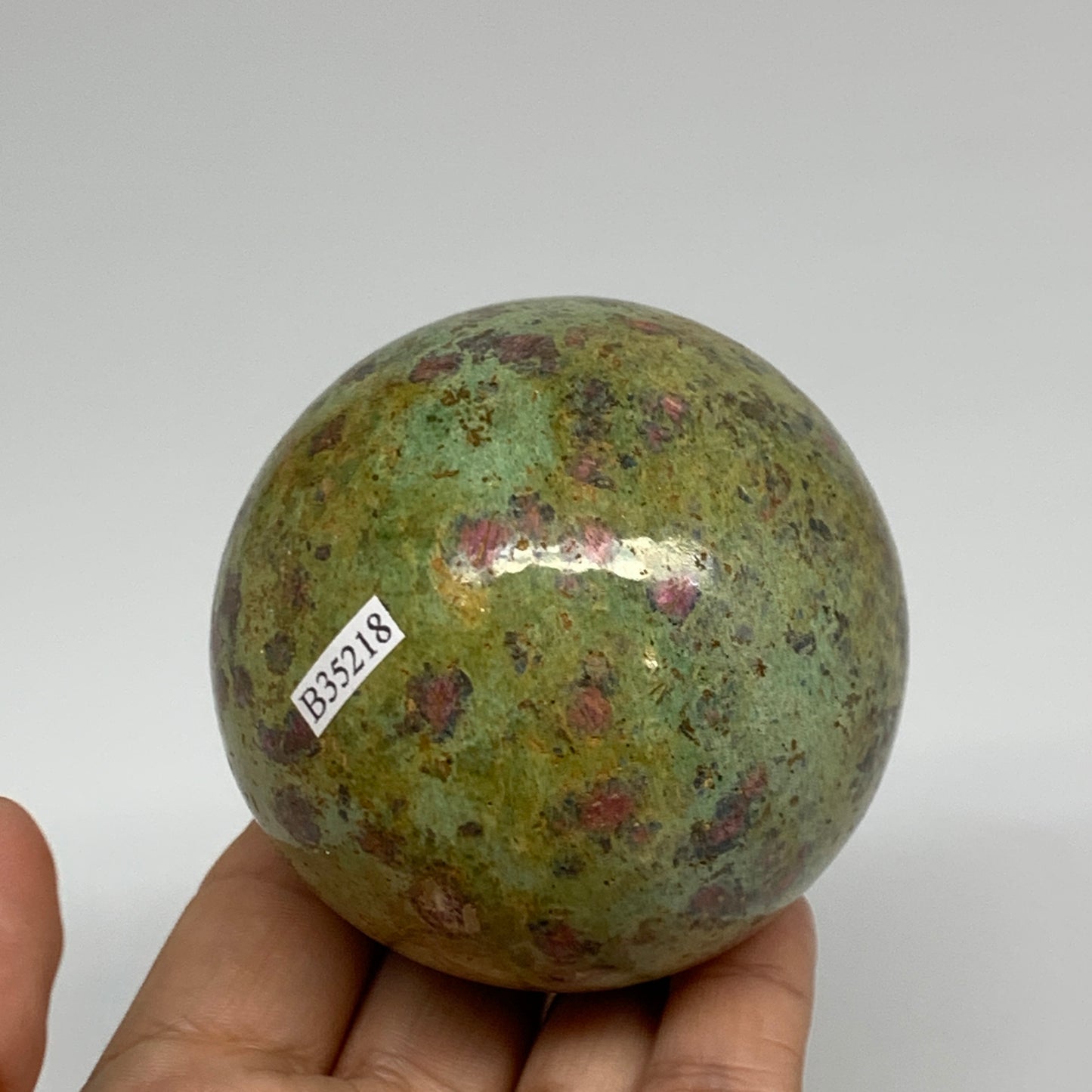 1.15 lbs, 2.7"(69mm), Zoisite with Ruby Sphere Sphere Ball Crystal, B25218