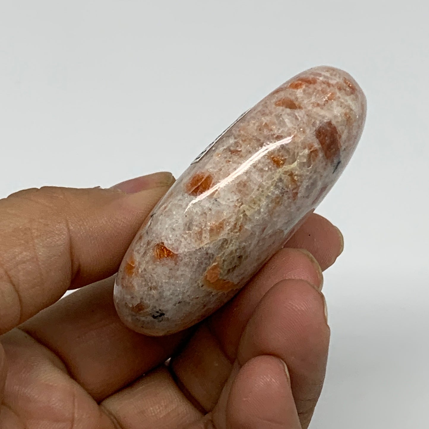 85.9g, 2.4"x1.7"x0.8", Natural Sunstone Palm-Stone Polished from India, B34603