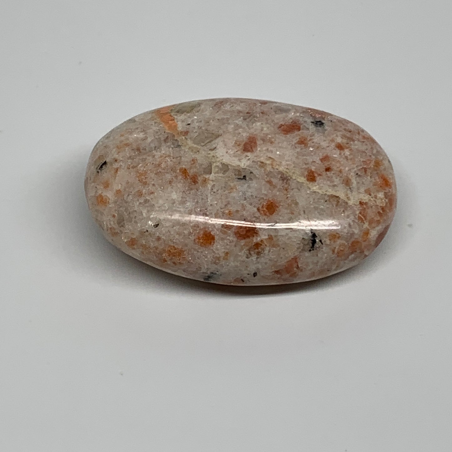 85.9g, 2.4"x1.7"x0.8", Natural Sunstone Palm-Stone Polished from India, B34603