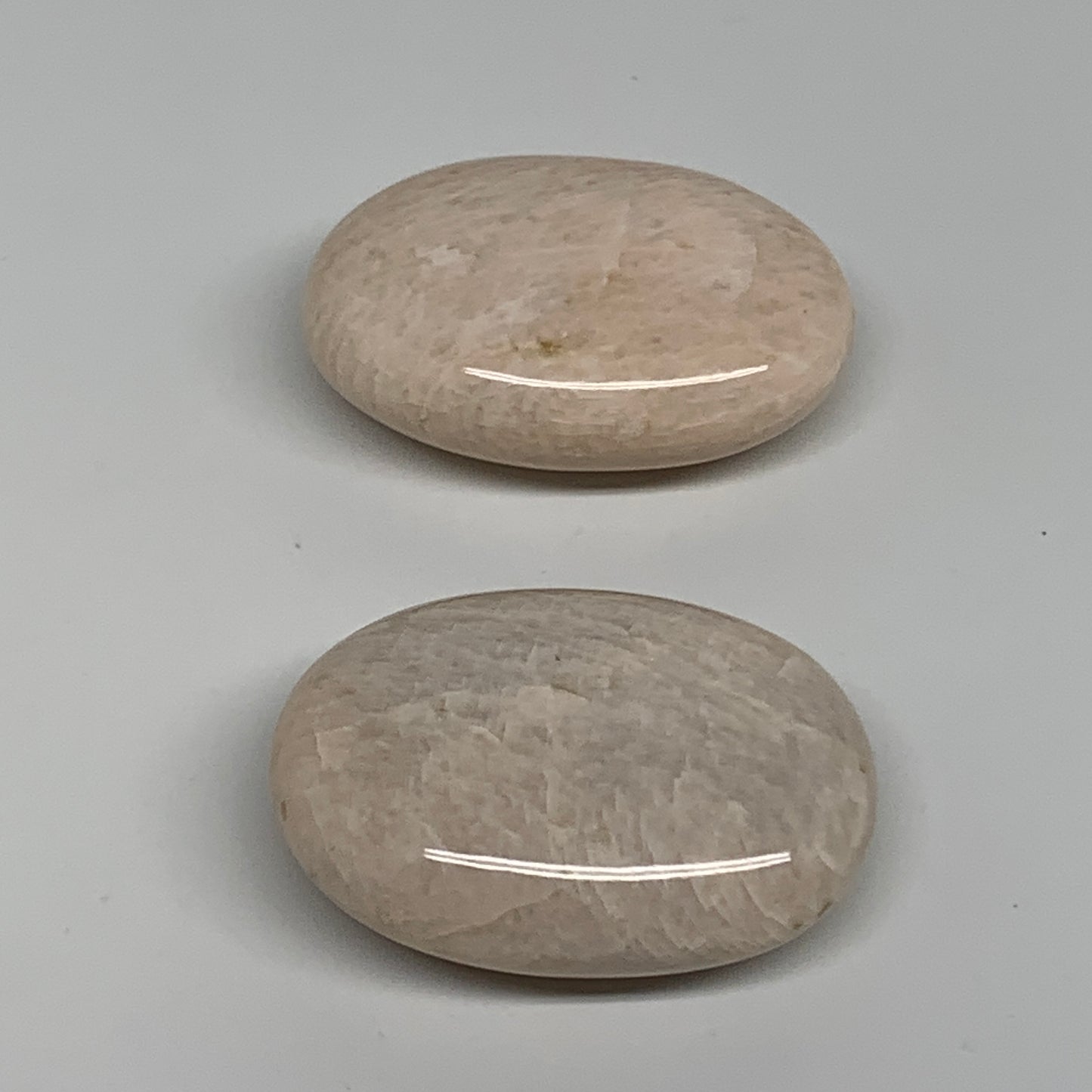120g,2.1"-2.2", 2pcs, Peach Moonstone Polished Palm-Stone Gemstone, B34775