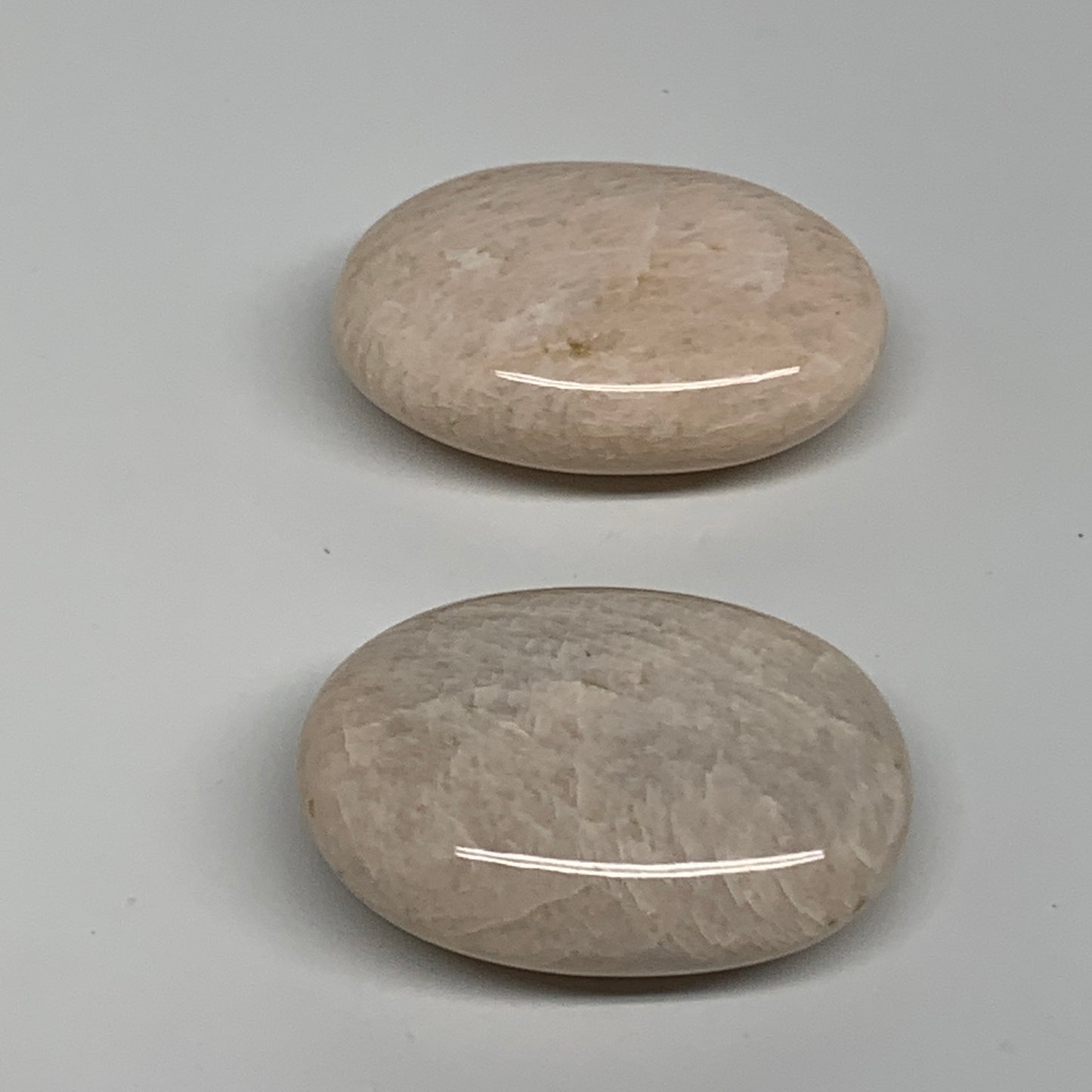 120g,2.1"-2.2", 2pcs, Peach Moonstone Polished Palm-Stone Gemstone, B34775