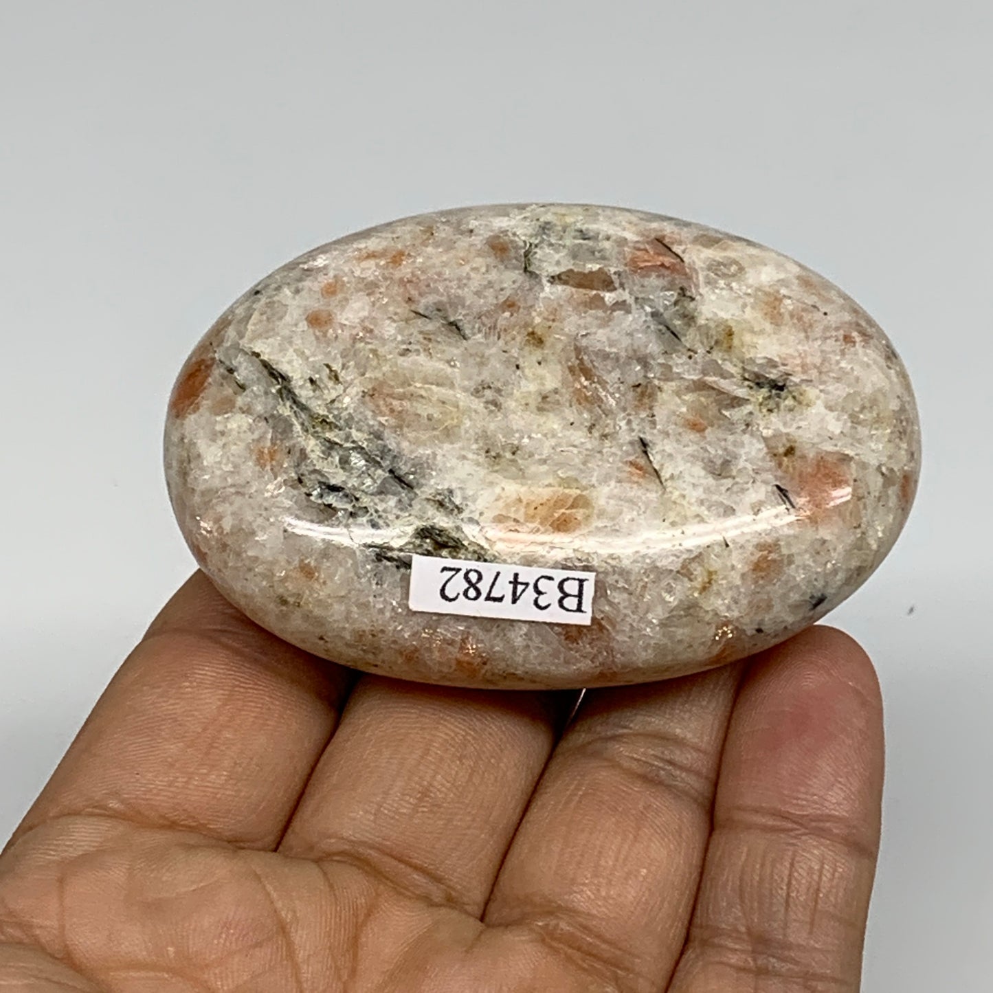 112.3g, 2.7"x1.9"x0.8", Natural Sunstone Palm-Stone Polished from India, B34782