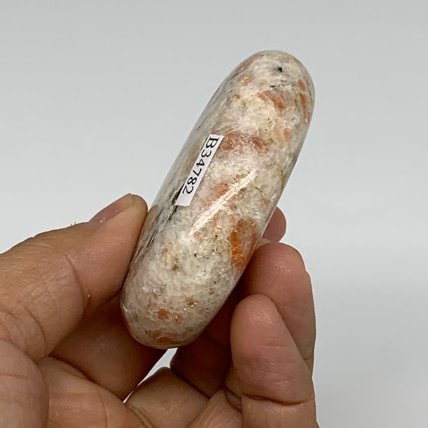 112.3g, 2.7"x1.9"x0.8", Natural Sunstone Palm-Stone Polished from India, B34782