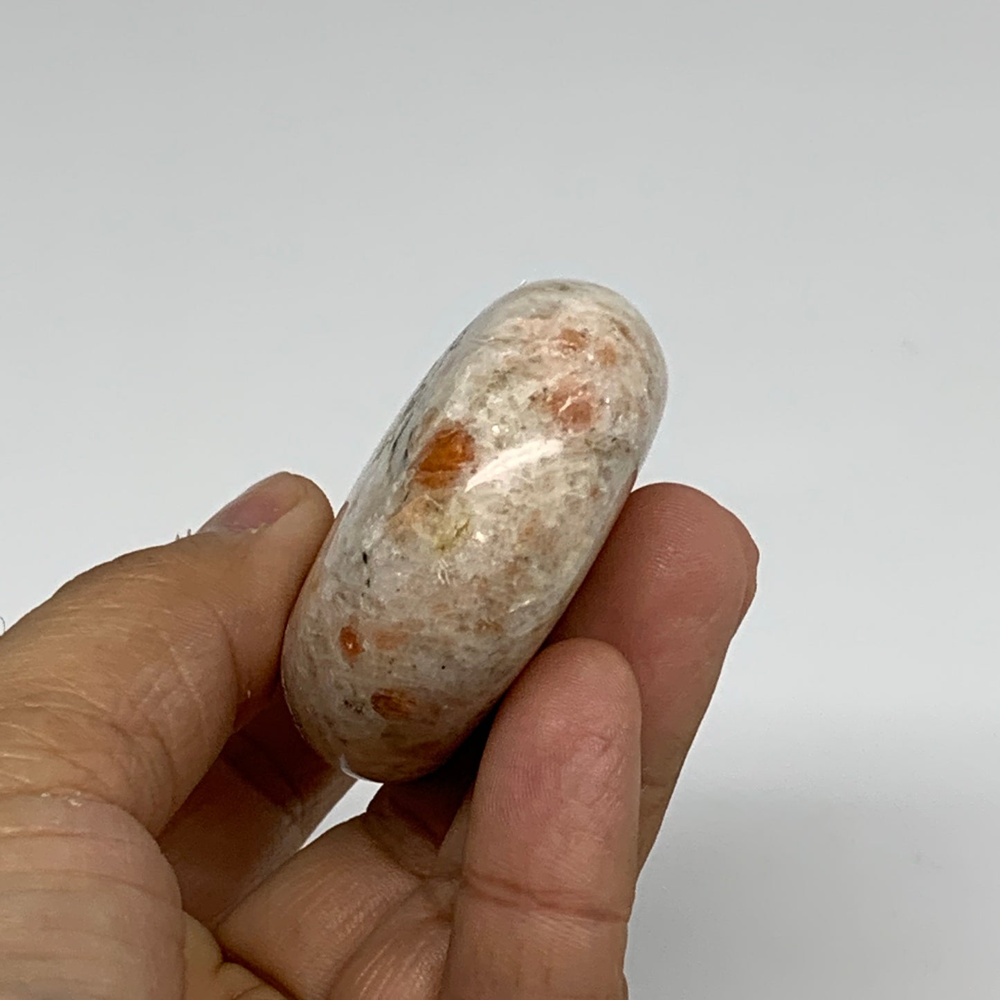 112.3g, 2.7"x1.9"x0.8", Natural Sunstone Palm-Stone Polished from India, B34782