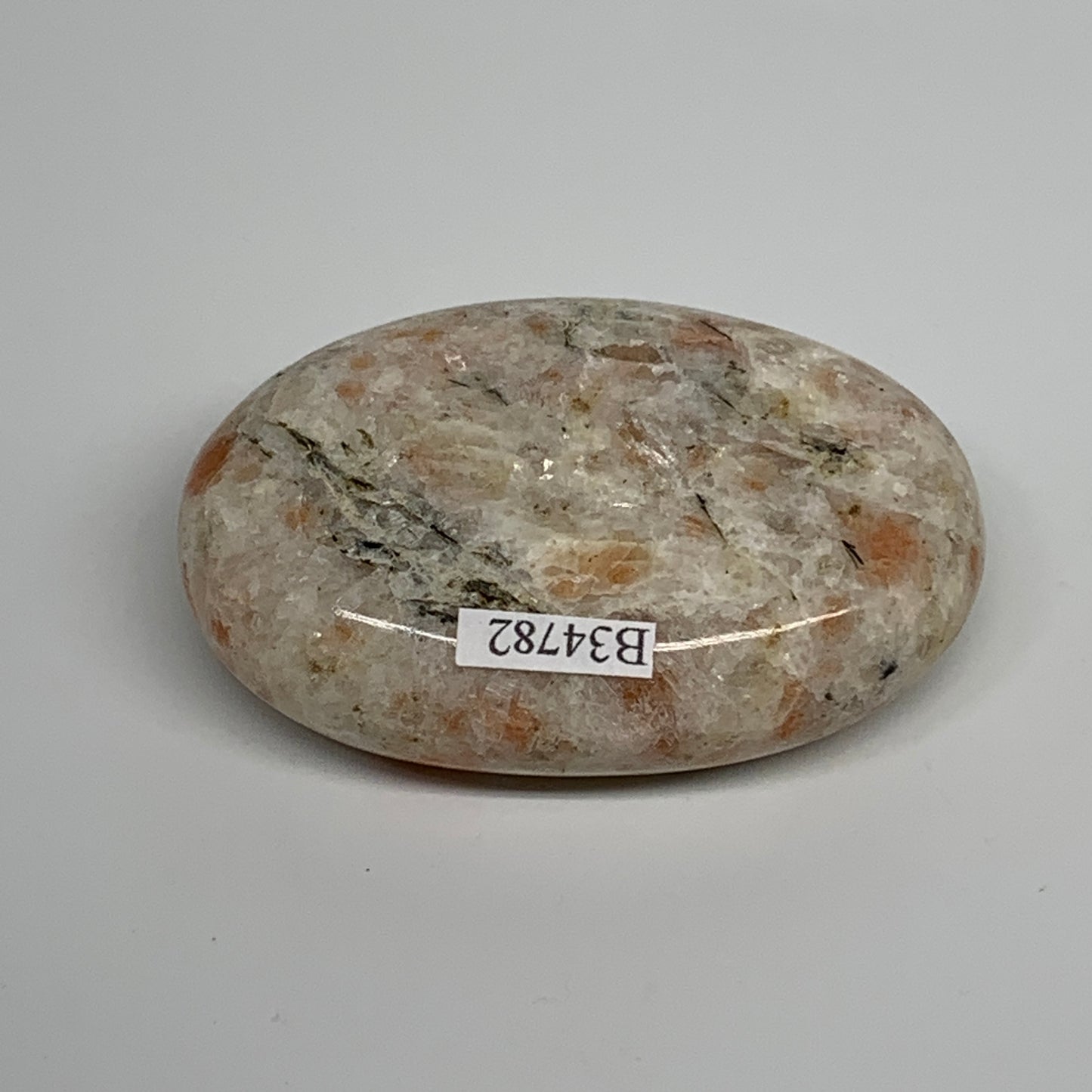 112.3g, 2.7"x1.9"x0.8", Natural Sunstone Palm-Stone Polished from India, B34782