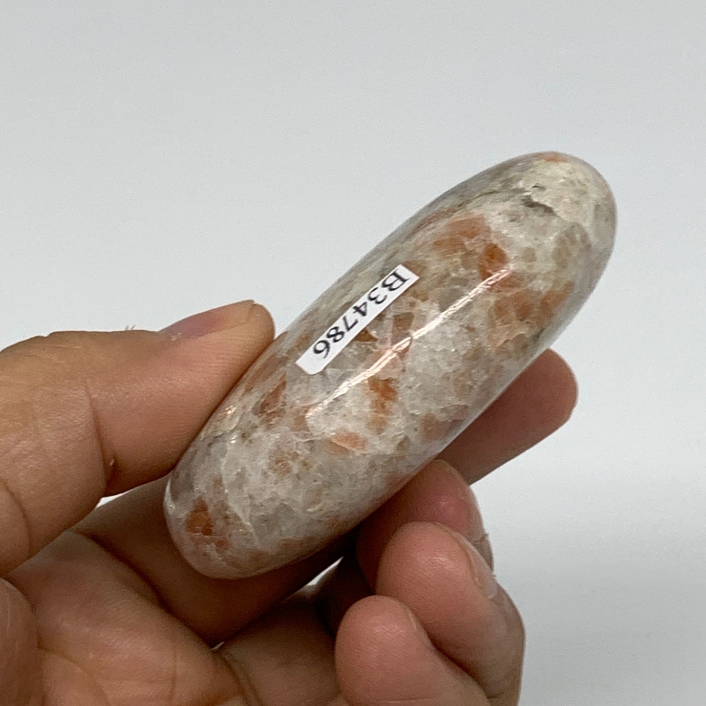 105.2g, 2.6"x1.8"x0.9", Natural Sunstone Palm-Stone Polished from India, B34786