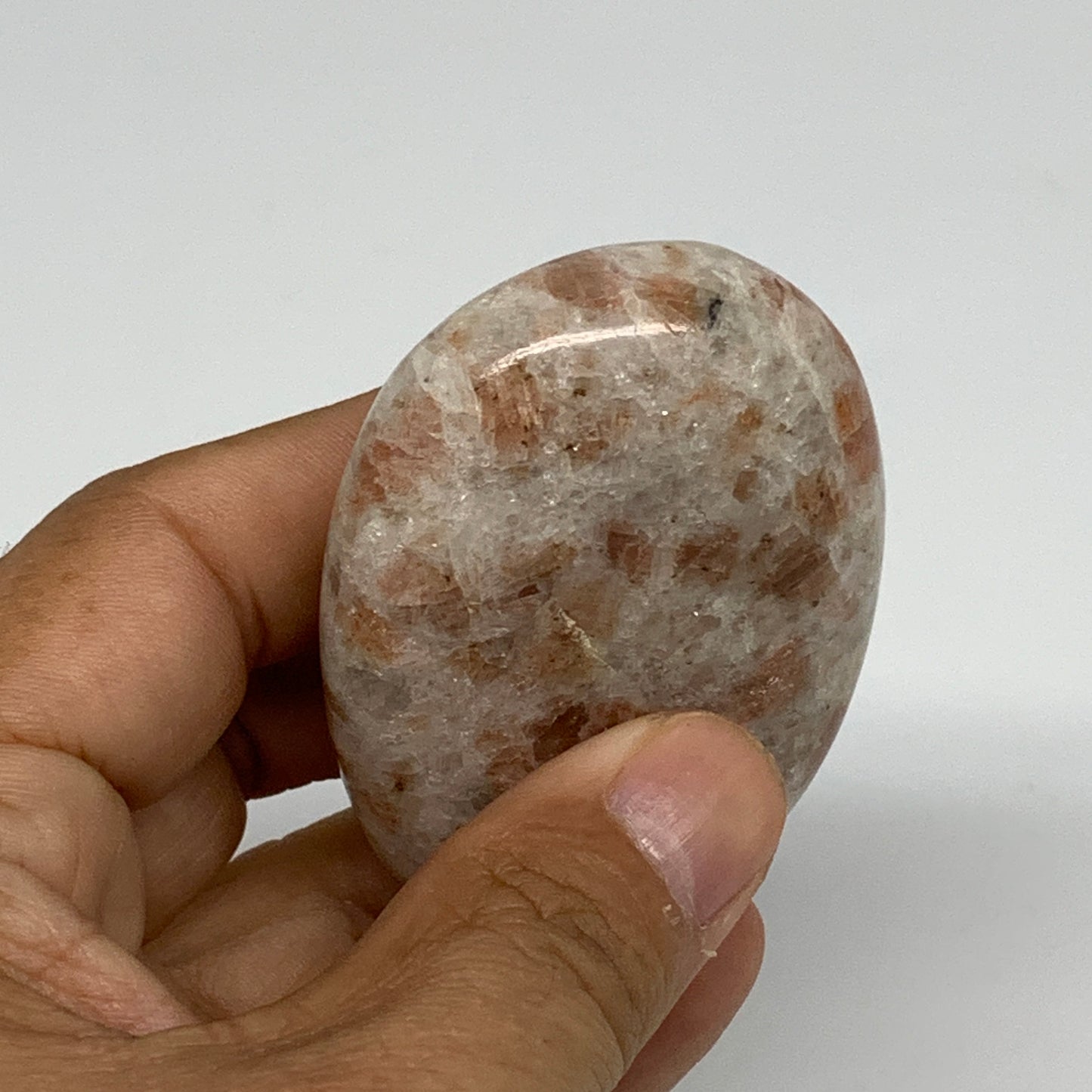 105.3g, 2.6"x1.8"x0.8", Natural Sunstone Palm-Stone Polished from India, B34787