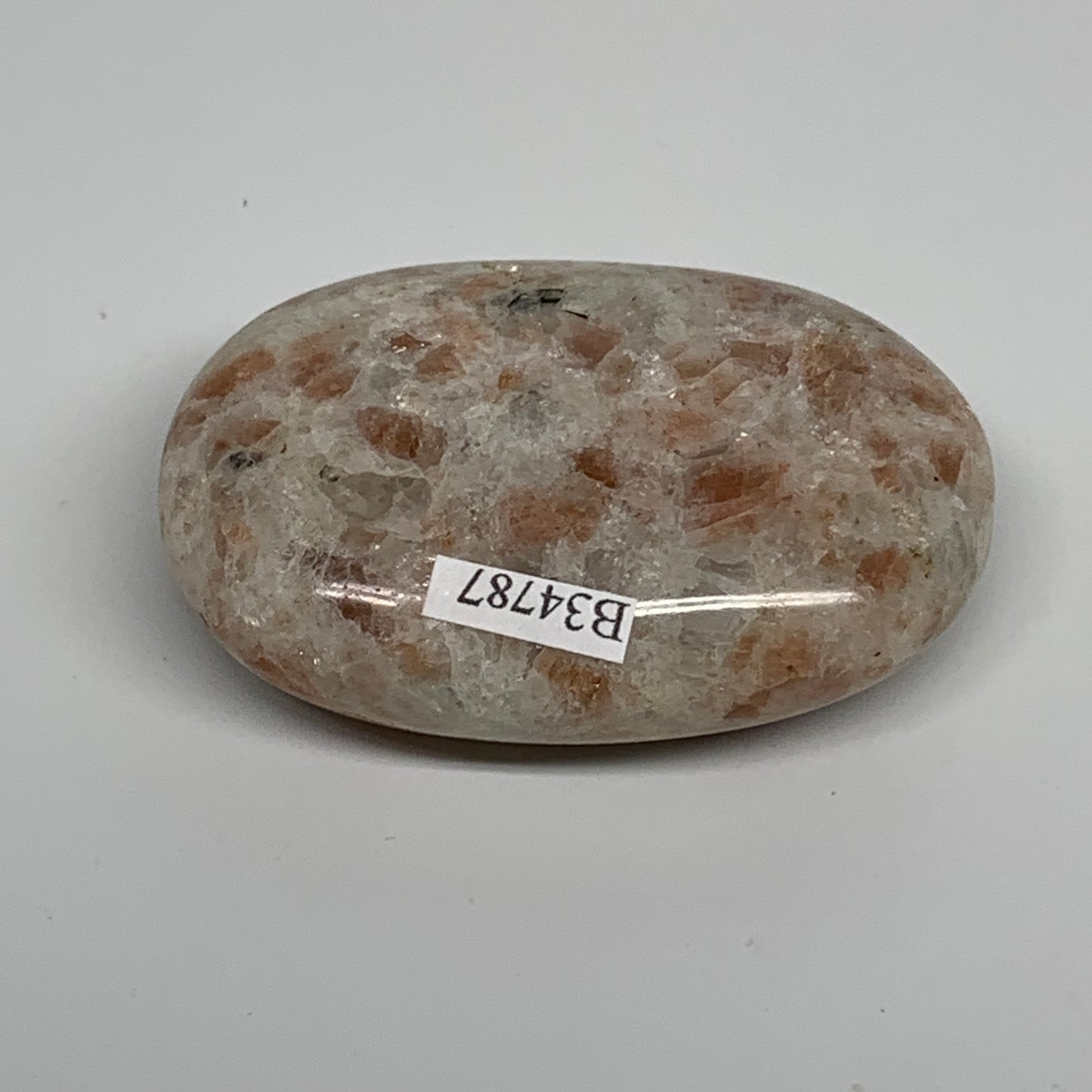 105.3g, 2.6"x1.8"x0.8", Natural Sunstone Palm-Stone Polished from India, B34787