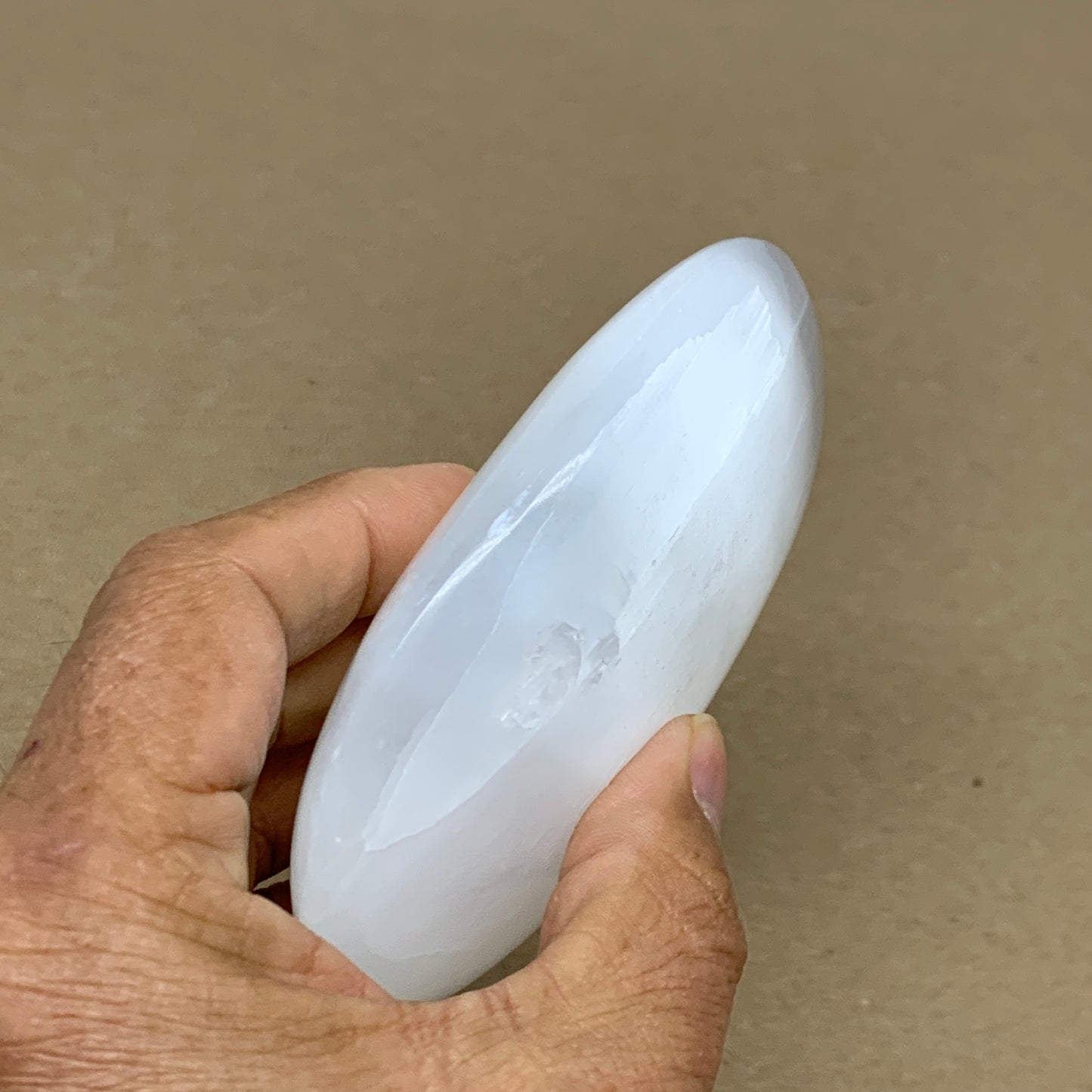 0.55 lbs, 3.9"x2.7"x1.2", White Selenite Palmstone Crystal Pillow Reiki, B36107