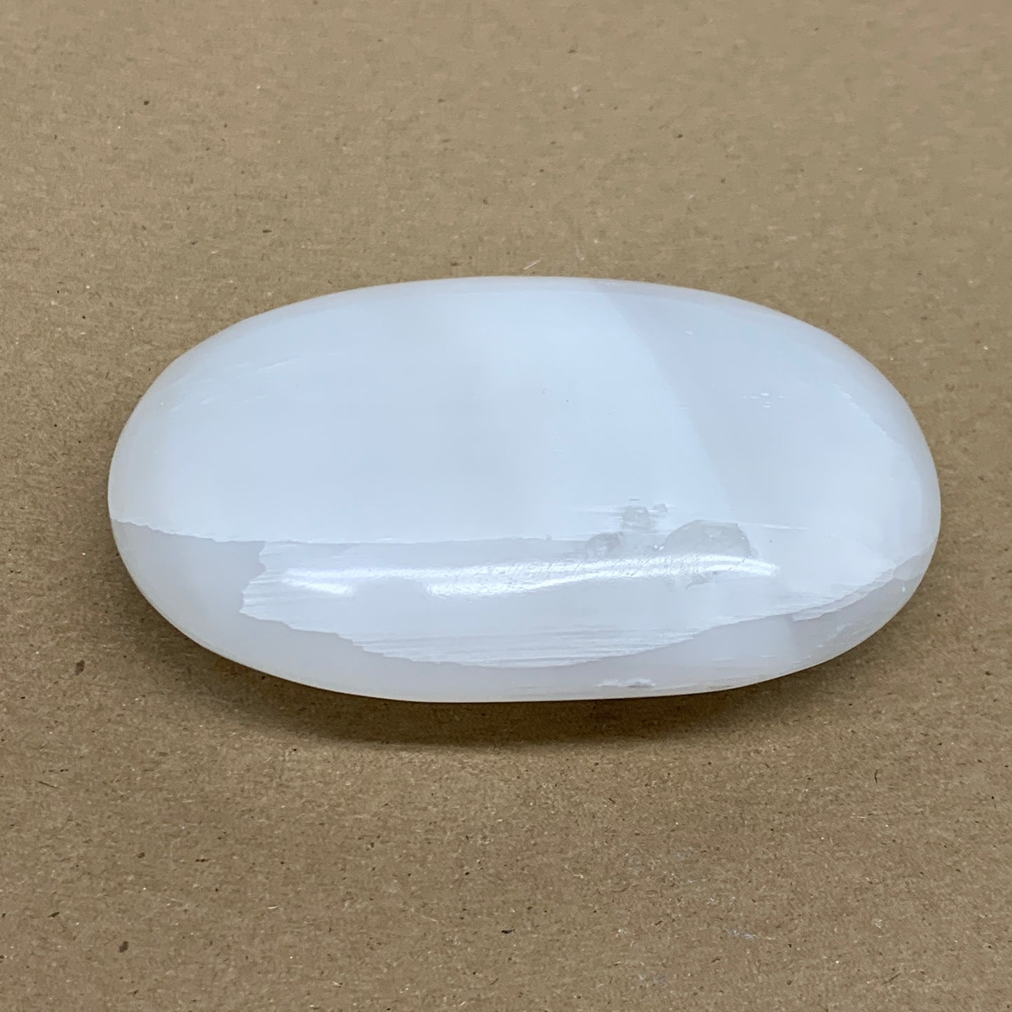 0.55 lbs, 3.9"x2.7"x1.2", White Selenite Palmstone Crystal Pillow Reiki, B36107