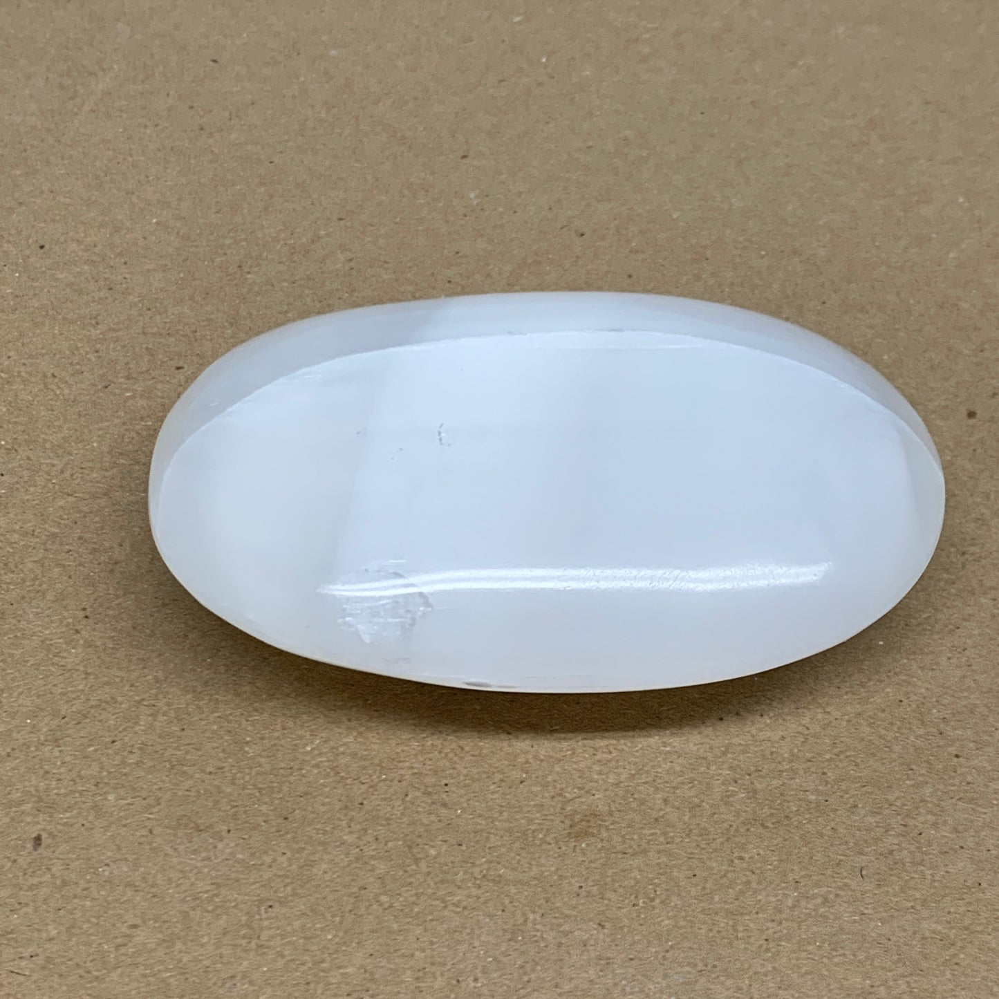 0.55 lbs, 3.9"x2.7"x1.2", White Selenite Palmstone Crystal Pillow Reiki, B36107