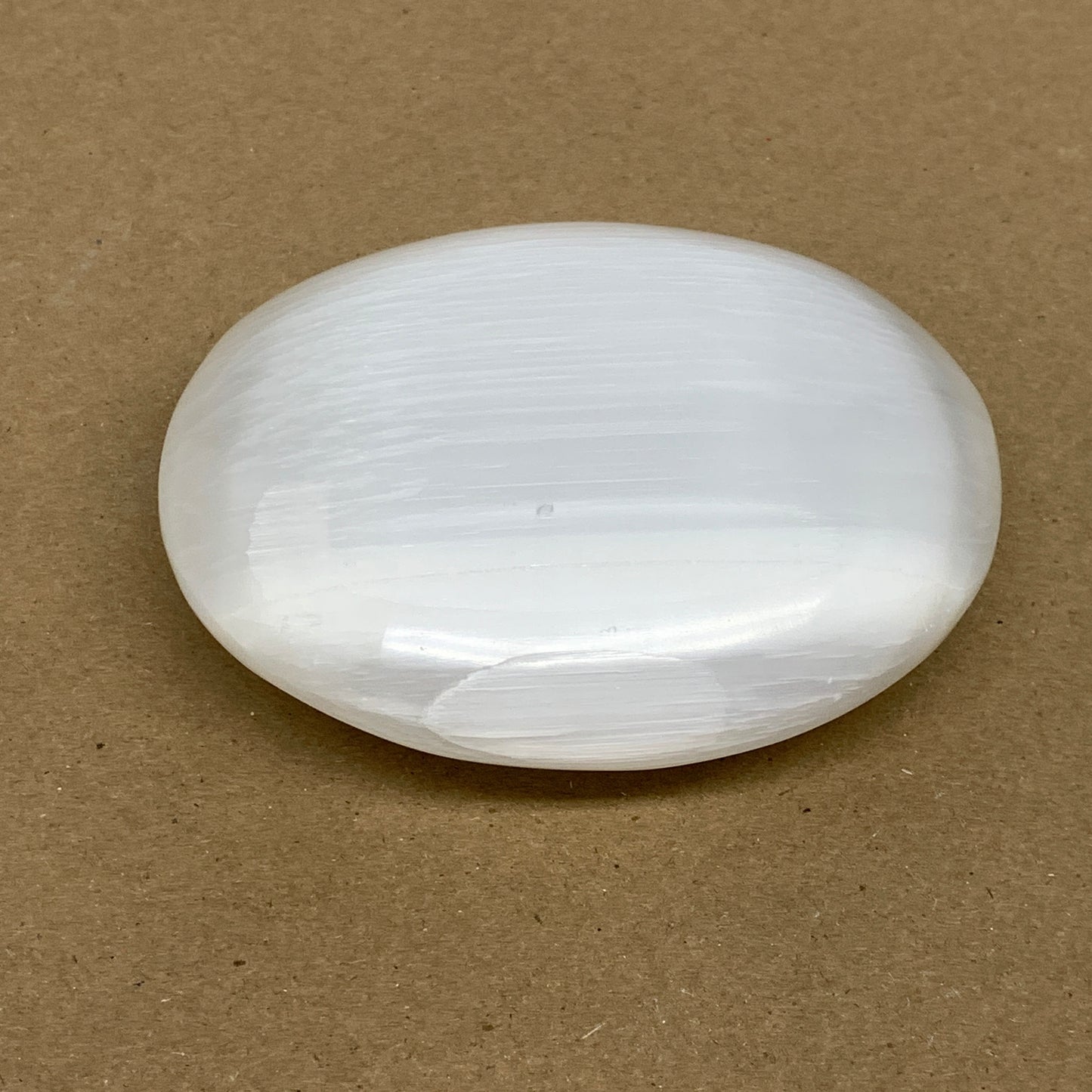 0.73 lbs, 3.9"x3.3"x1.3", White Selenite Palmstone Crystal Pillow Reiki, B36125