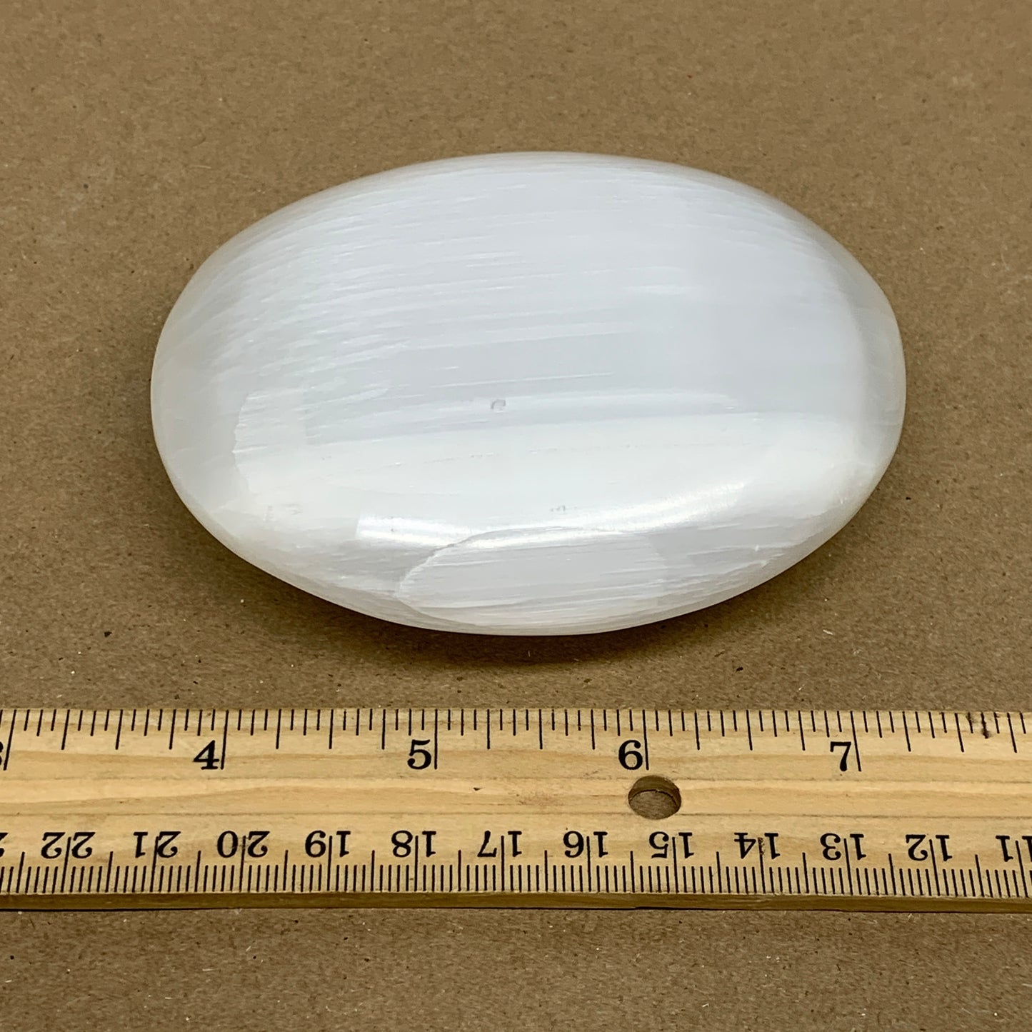 0.73 lbs, 3.9"x3.3"x1.3", White Selenite Palmstone Crystal Pillow Reiki, B36125