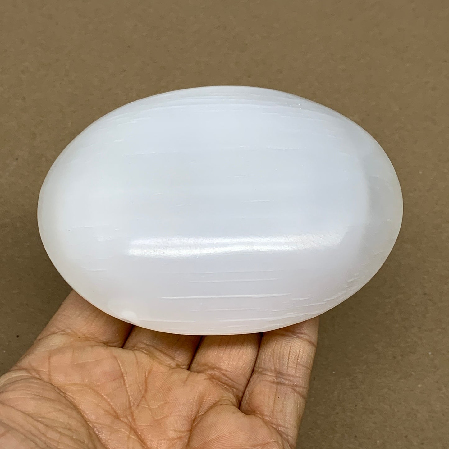 0.69 lbs, 3.9"x3.1"x1.3", White Selenite Palmstone Crystal Pillow Reiki, B36126