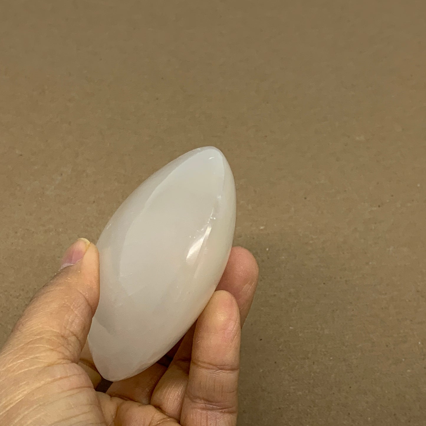 0.69 lbs, 3.9"x3.1"x1.3", White Selenite Palmstone Crystal Pillow Reiki, B36126