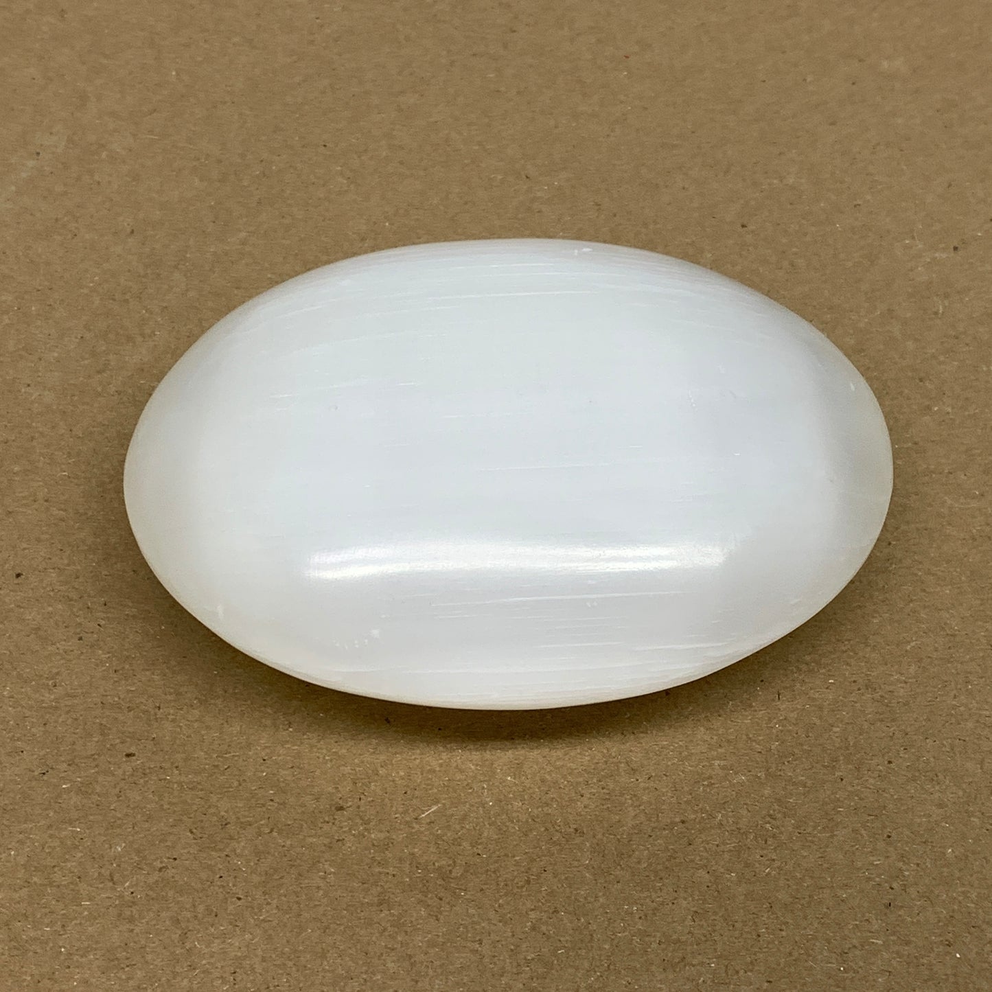 0.69 lbs, 3.9"x3.1"x1.3", White Selenite Palmstone Crystal Pillow Reiki, B36126