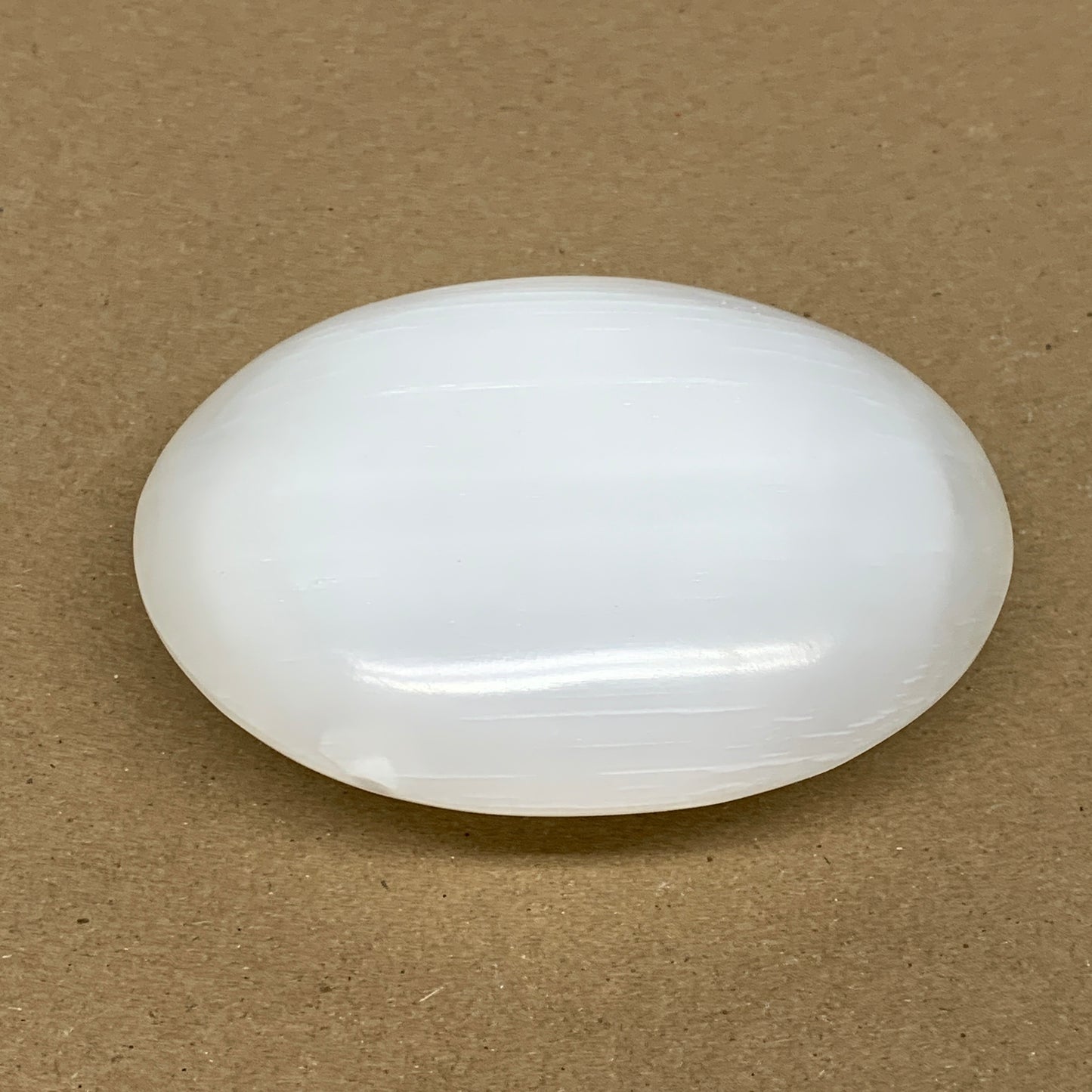 0.69 lbs, 3.9"x3.1"x1.3", White Selenite Palmstone Crystal Pillow Reiki, B36126