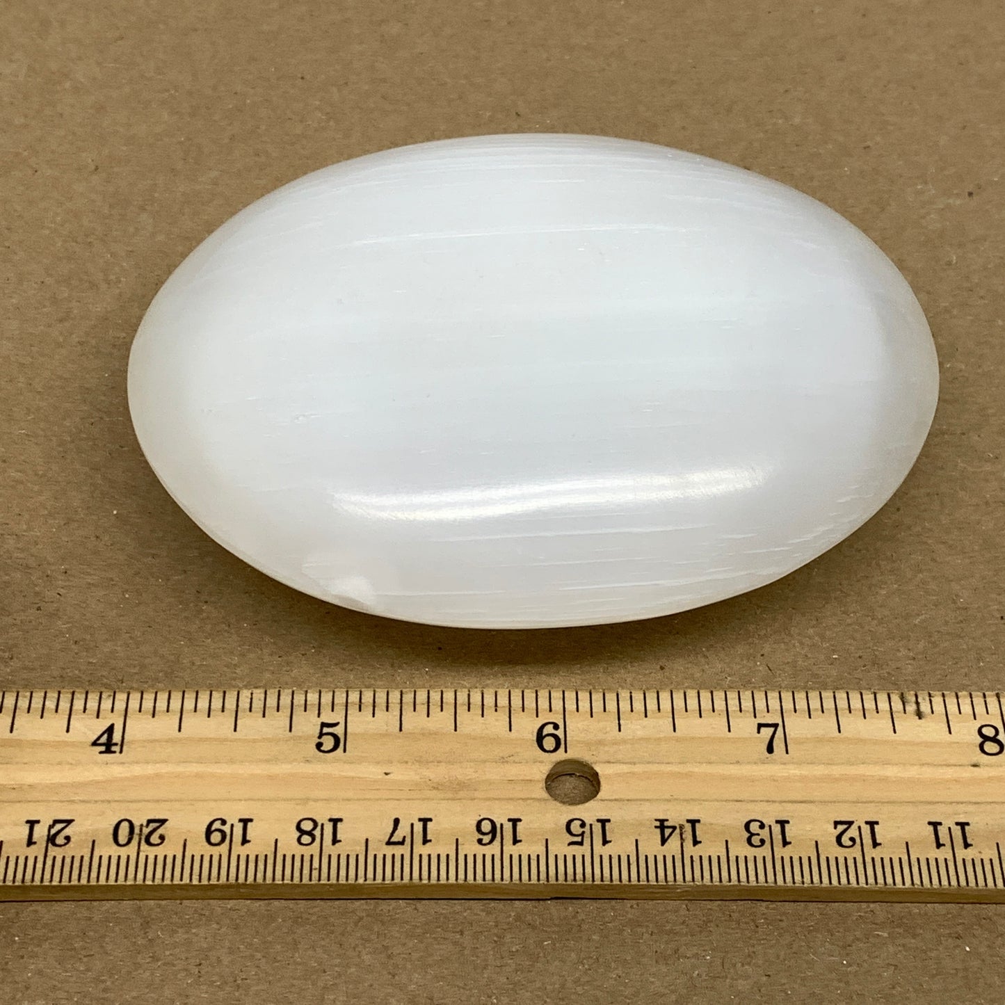 0.69 lbs, 3.9"x3.1"x1.3", White Selenite Palmstone Crystal Pillow Reiki, B36126