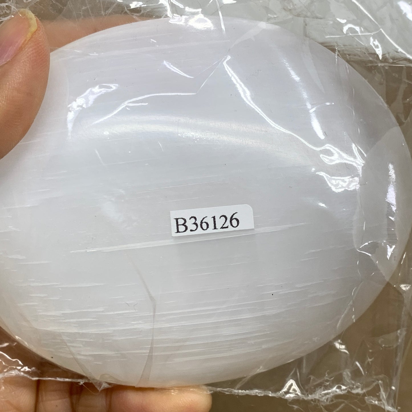 0.69 lbs, 3.9"x3.1"x1.3", White Selenite Palmstone Crystal Pillow Reiki, B36126