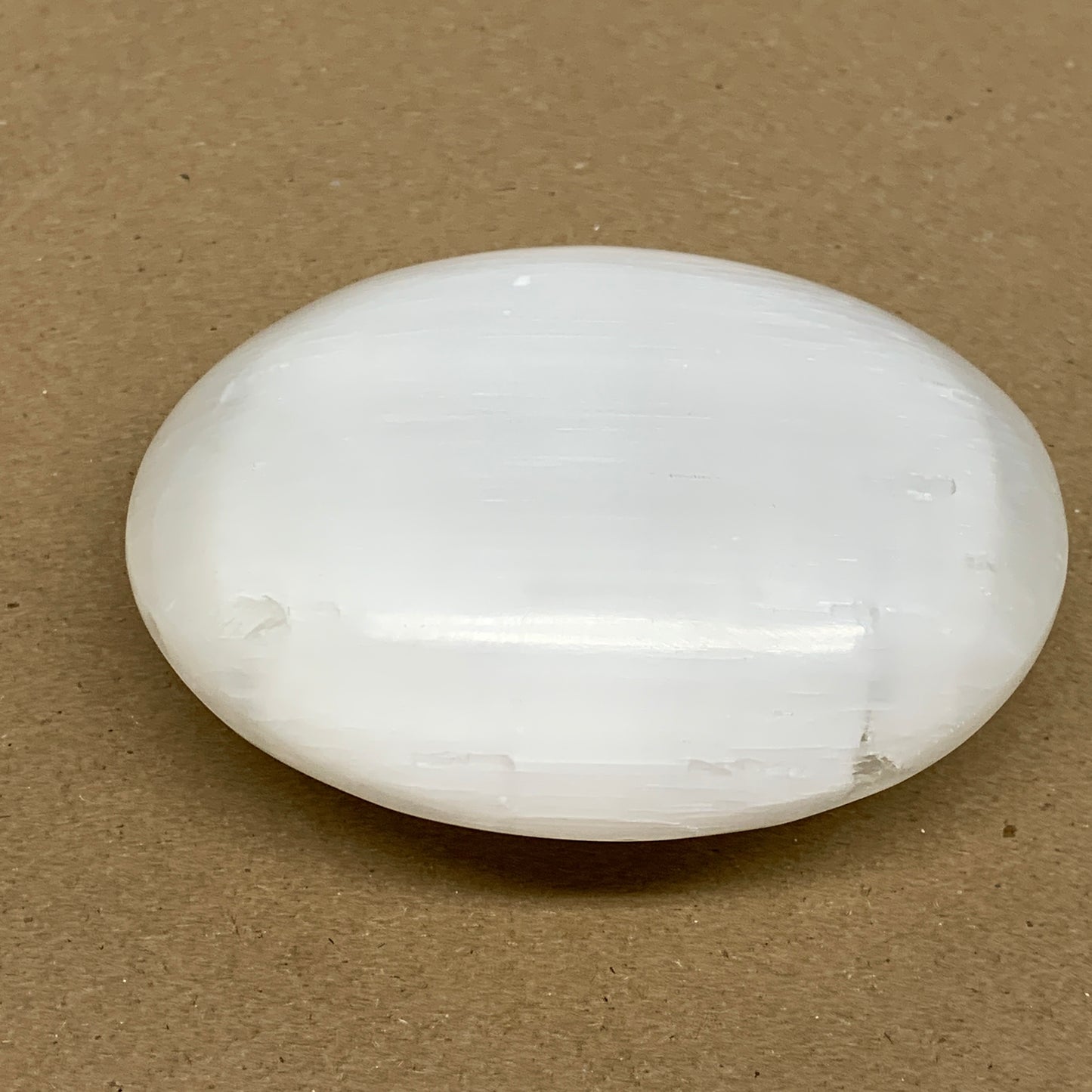 0.77 lbs, 3.9"x3.2"x1.3", White Selenite Palmstone Crystal Pillow Reiki, B36130