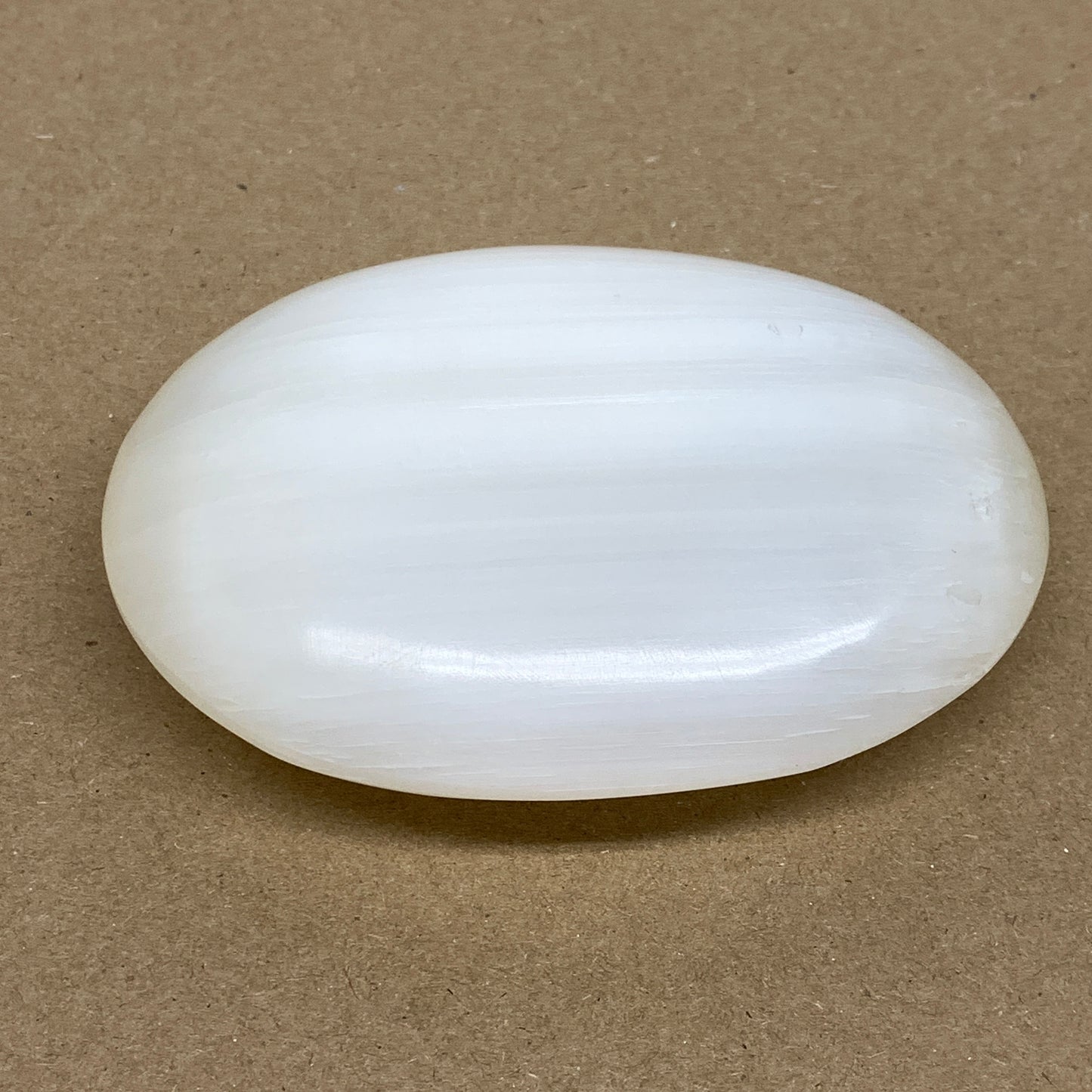 0.55 lbs, 3.8"x2.9"x1.1", White Selenite Palmstone Crystal Pillow Reiki, B36131
