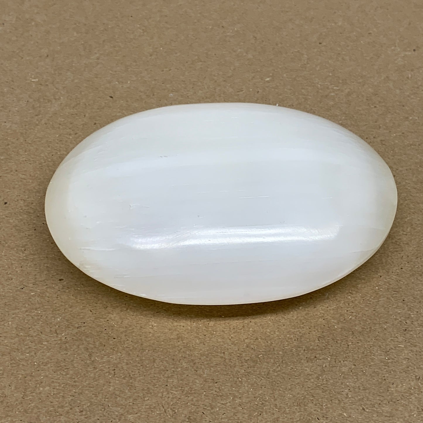 0.55 lbs, 3.8"x2.9"x1.1", White Selenite Palmstone Crystal Pillow Reiki, B36131