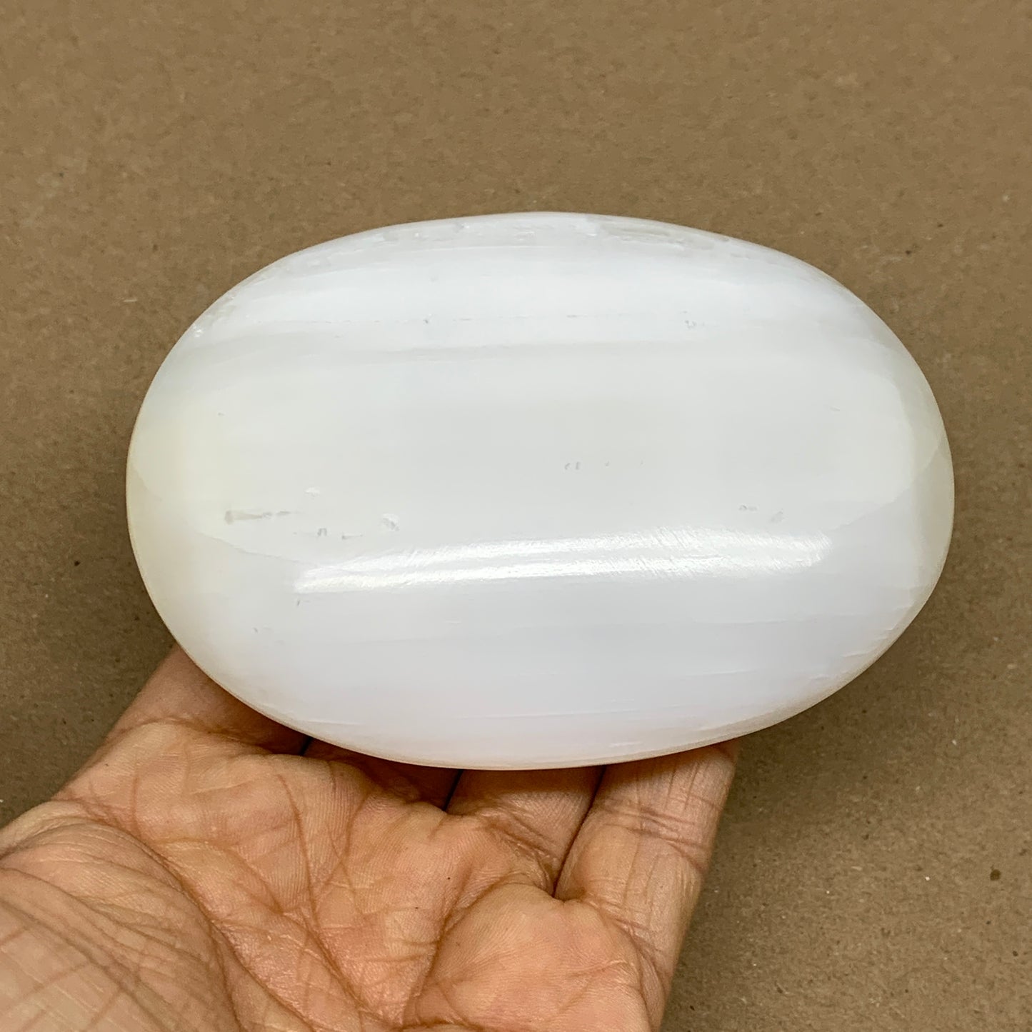 0.67 lbs, 4"x3.1"x1.3", White Selenite Palmstone Crystal Pillow Reiki, B36142