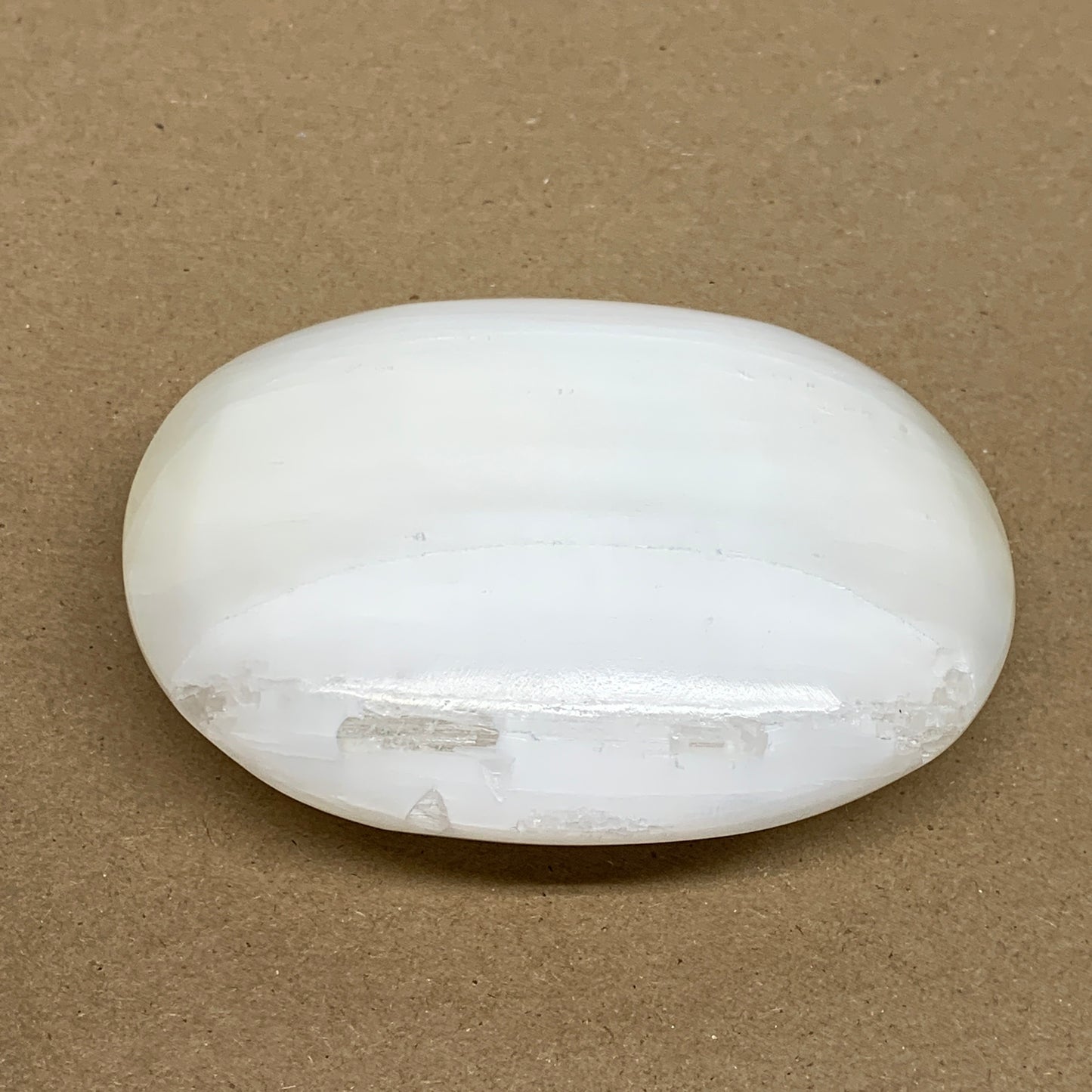 0.67 lbs, 4"x3.1"x1.3", White Selenite Palmstone Crystal Pillow Reiki, B36142
