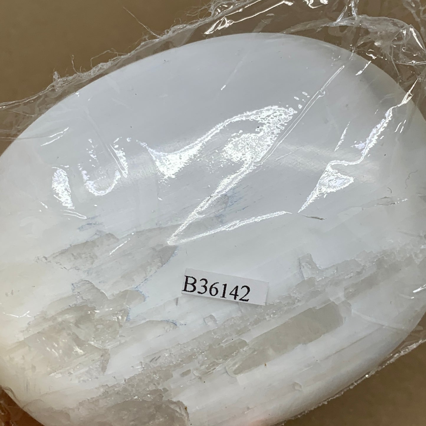0.67 lbs, 4"x3.1"x1.3", White Selenite Palmstone Crystal Pillow Reiki, B36142