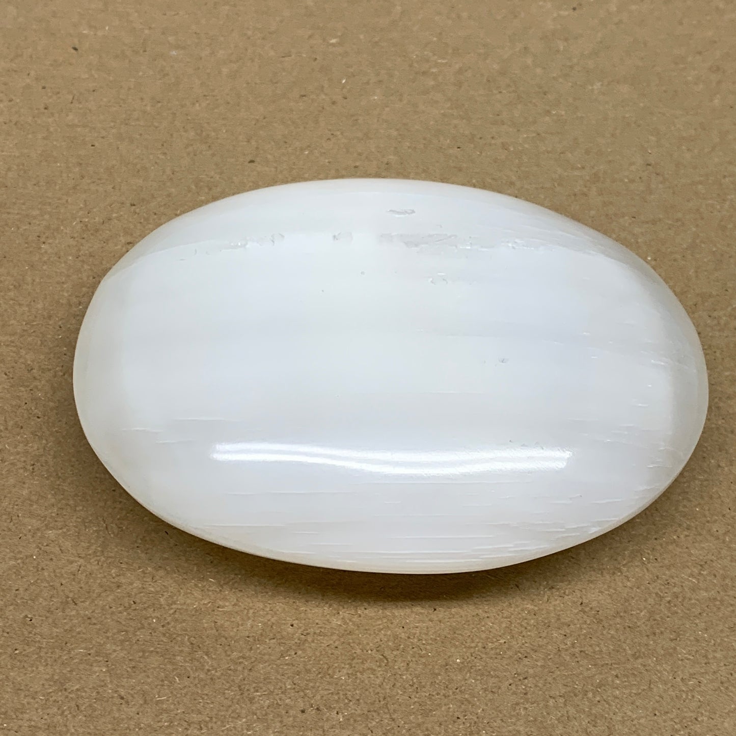 0.7 lbs, 4"x3.2"x1.3", White Selenite Palmstone Crystal Pillow Reiki, B36143