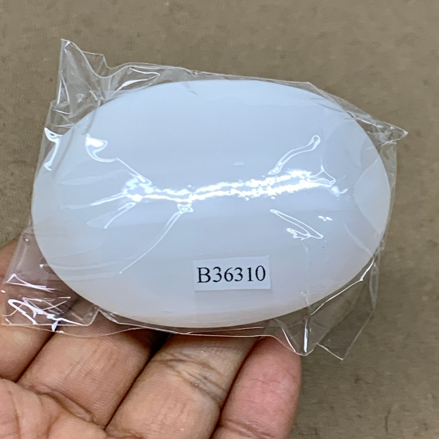 98g, 2.7"x1.9"x1", White Selenite Palmstone Crystal Pillow Reiki, B36310
