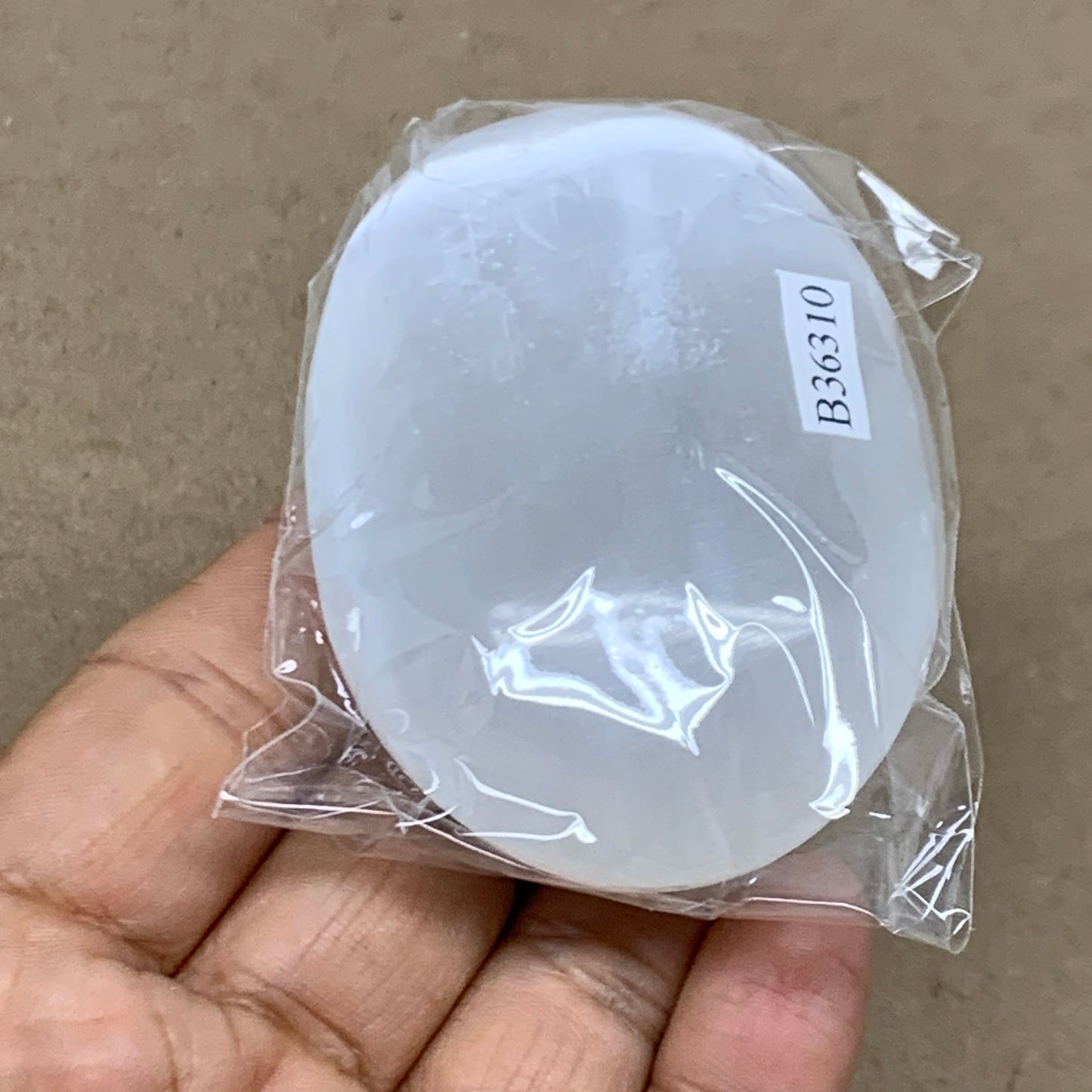 98g, 2.7"x1.9"x1", White Selenite Palmstone Crystal Pillow Reiki, B36310