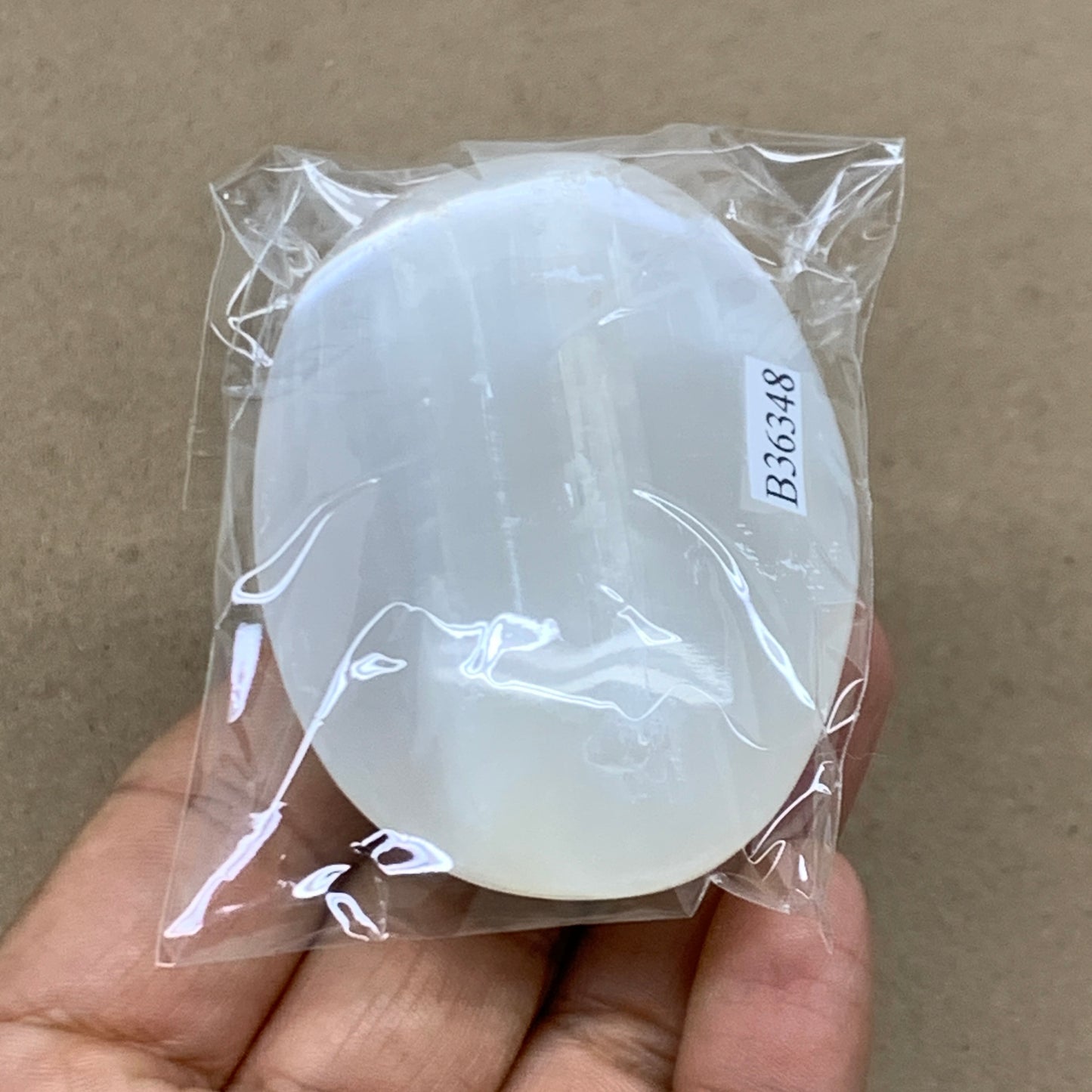 90g, 2.7"x1.8"x0.9", White Selenite Palmstone Crystal Pillow Reiki, B36348