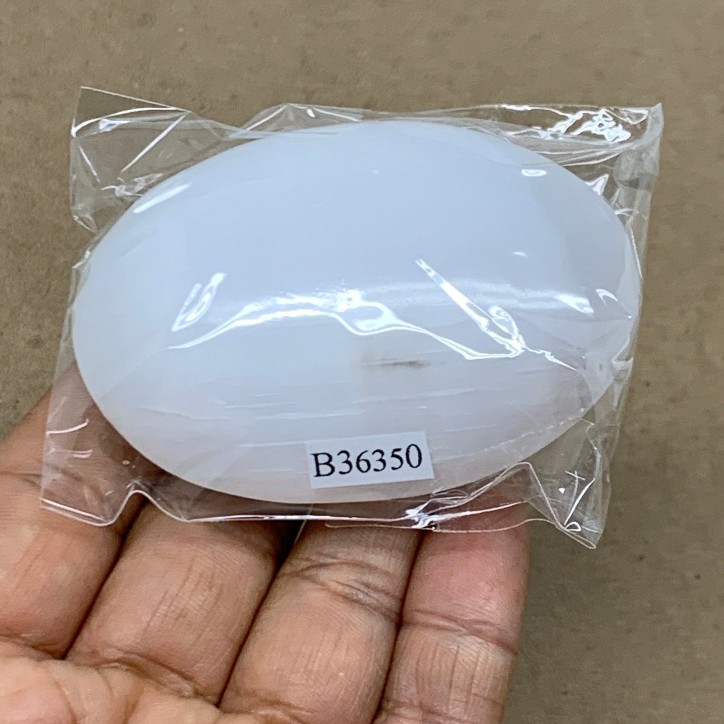 87g, 2.7"x1.9"x0.9", White Selenite Palmstone Crystal Pillow Reiki, B36350