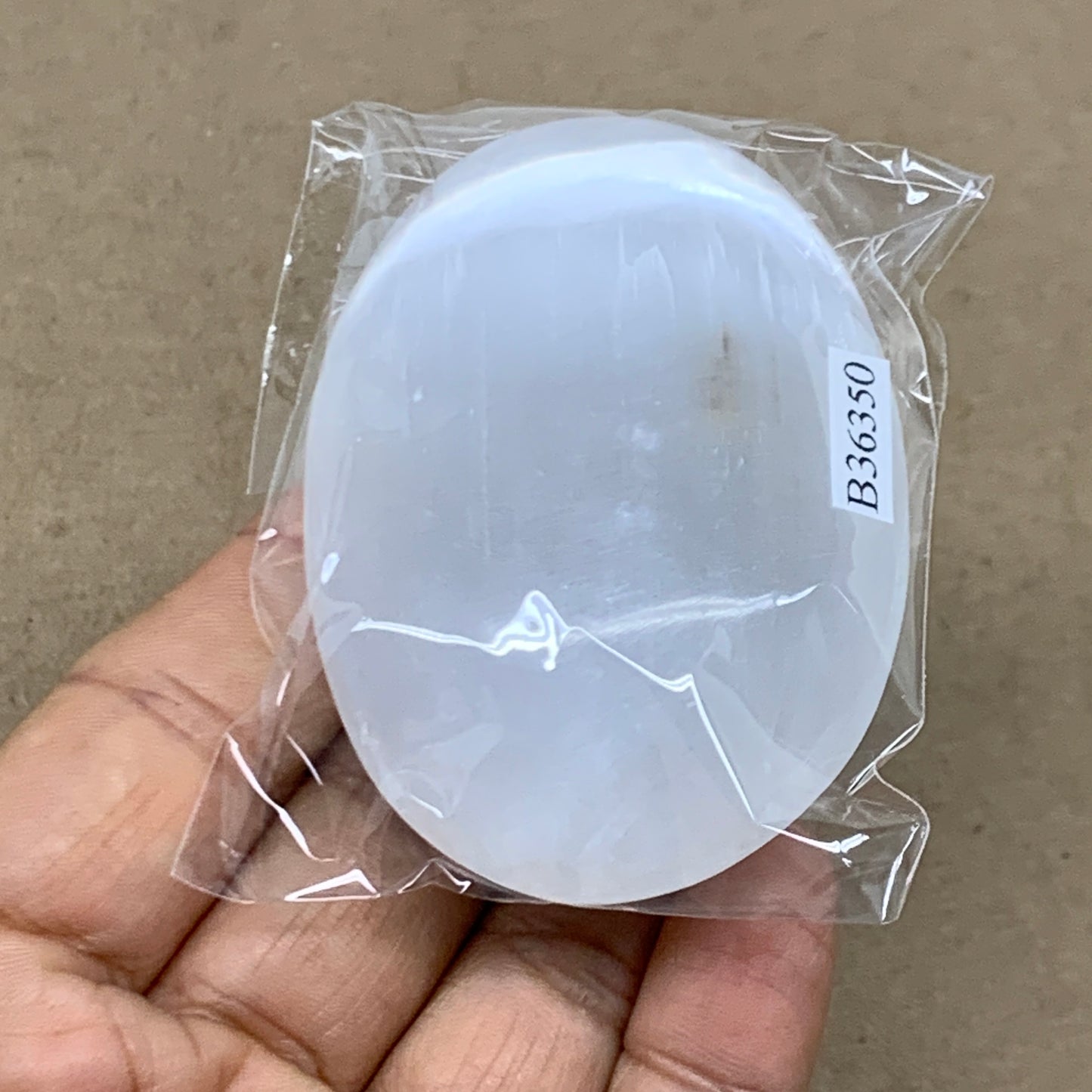 87g, 2.7"x1.9"x0.9", White Selenite Palmstone Crystal Pillow Reiki, B36350