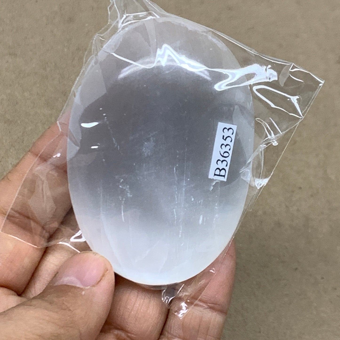 84g, 2.7"x1.9"x0.9", White Selenite Palmstone Crystal Pillow Reiki, B36353