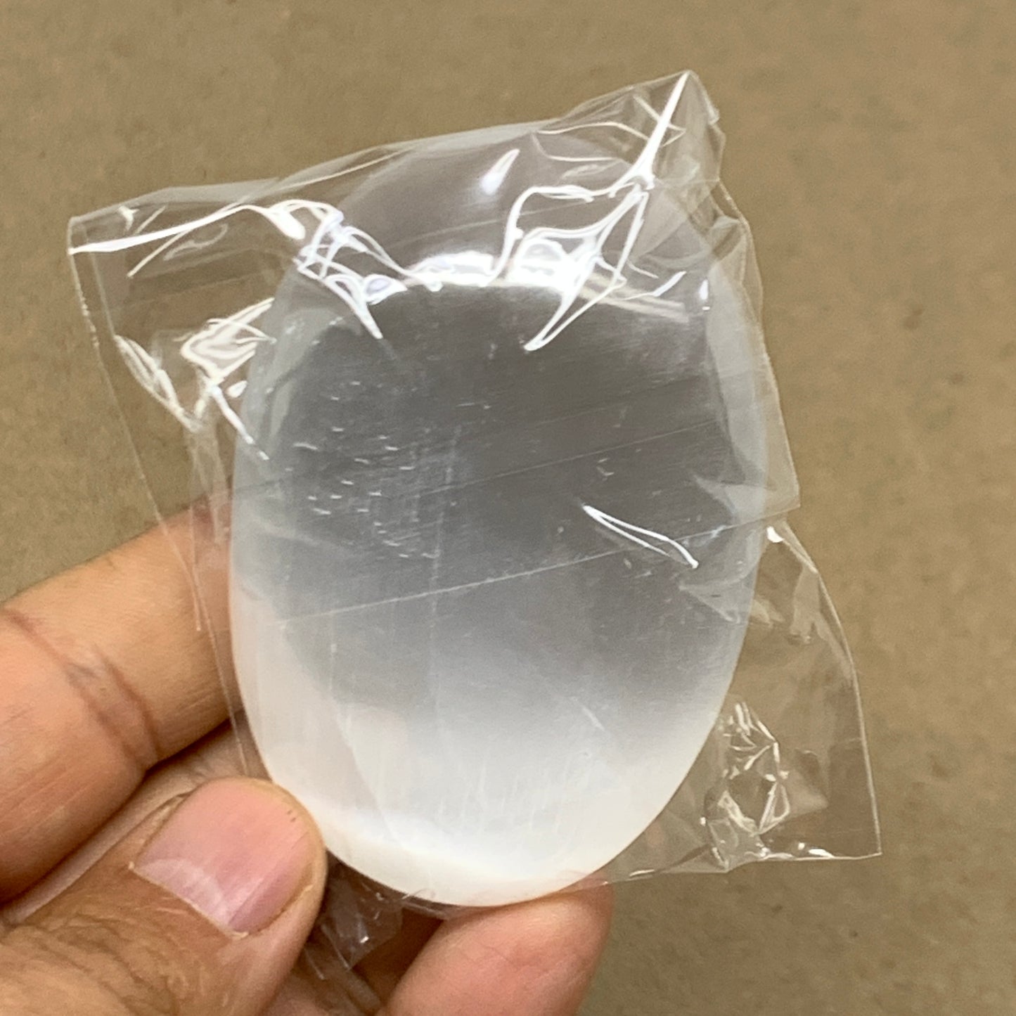 84g, 2.7"x1.9"x0.9", White Selenite Palmstone Crystal Pillow Reiki, B36353