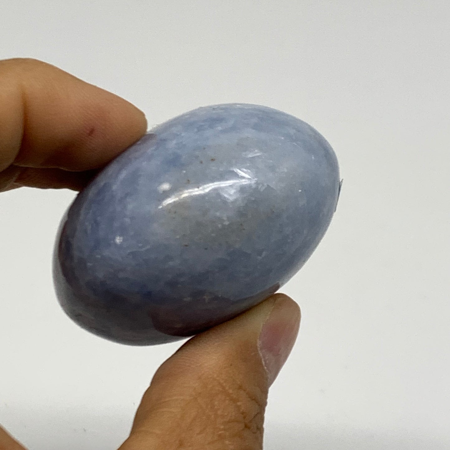 128.1g, 2.2"x1.9"x1.3" Blue Calcite Palm-Stone Polished Tumbled, B38110