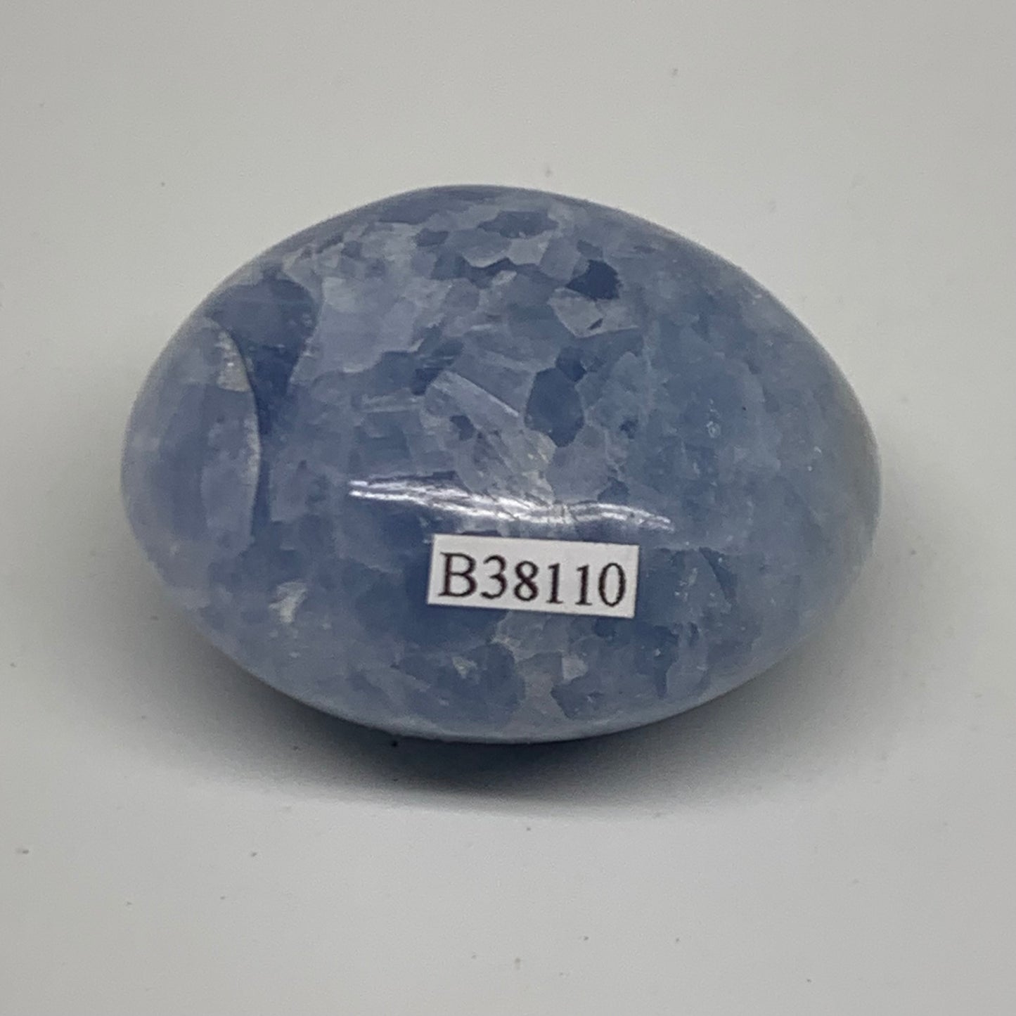 128.1g, 2.2"x1.9"x1.3" Blue Calcite Palm-Stone Polished Tumbled, B38110