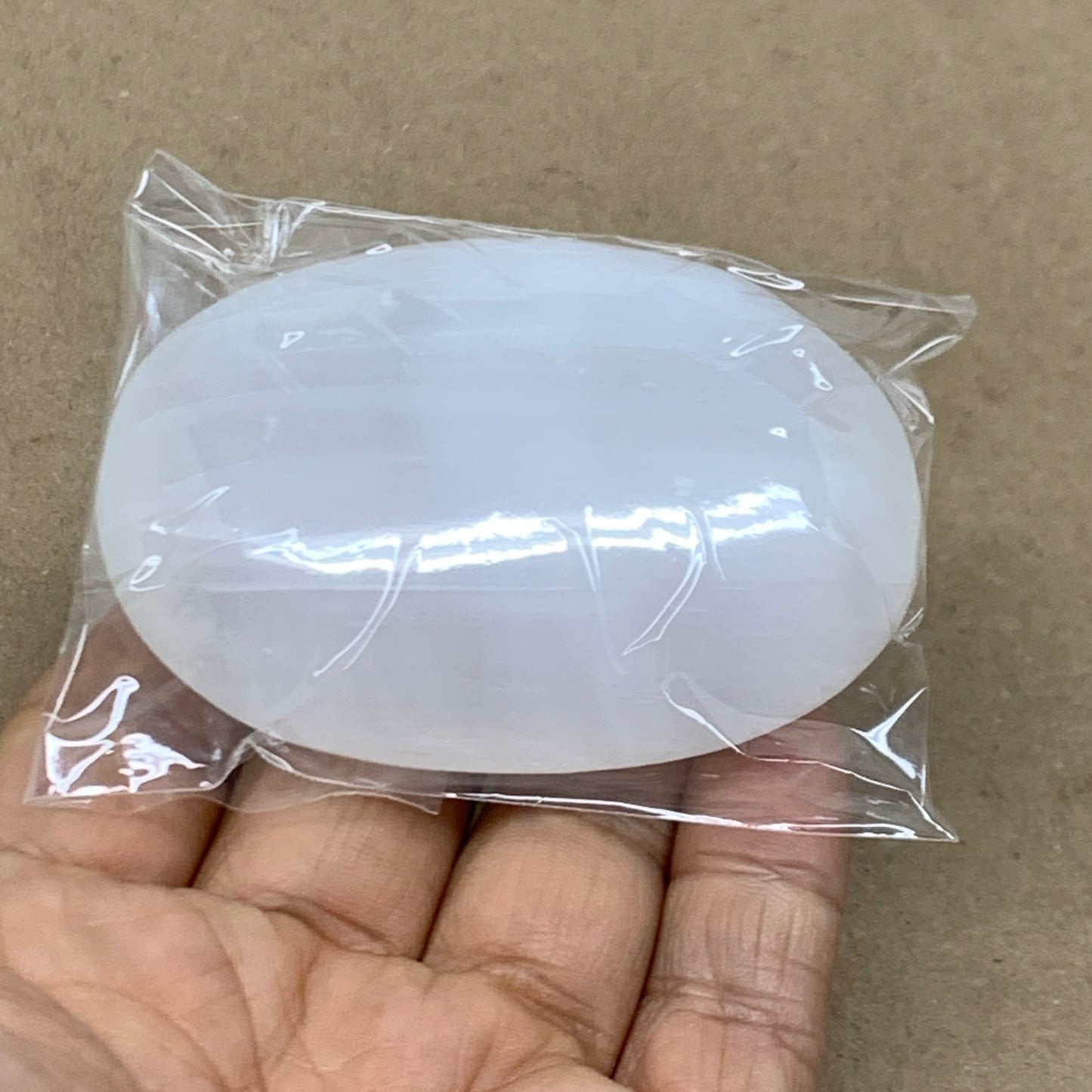 94g, 2.7"x1.9"x0.9", White Selenite Palmstone Crystal Pillow Reiki, B36358