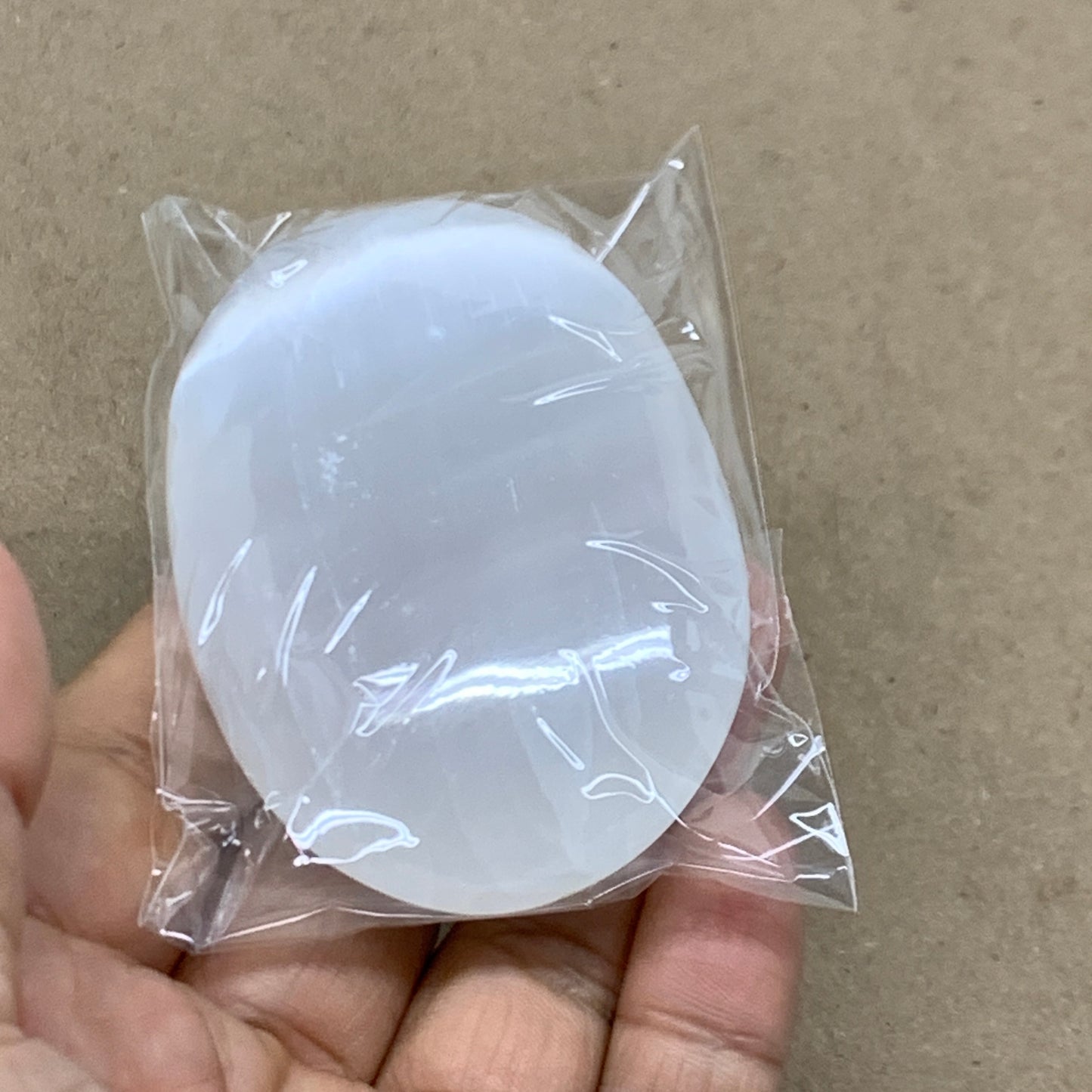 94g, 2.7"x1.9"x0.9", White Selenite Palmstone Crystal Pillow Reiki, B36358