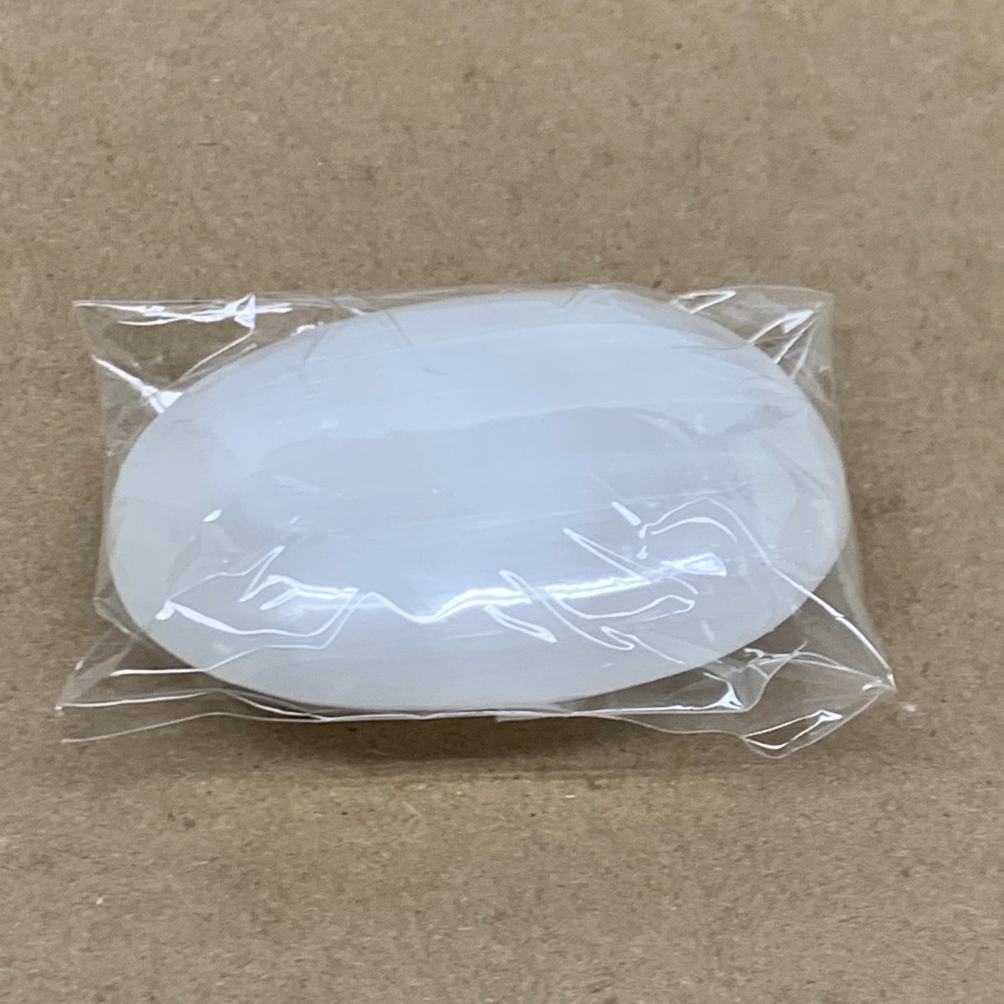 94g, 2.7"x1.9"x0.9", White Selenite Palmstone Crystal Pillow Reiki, B36358